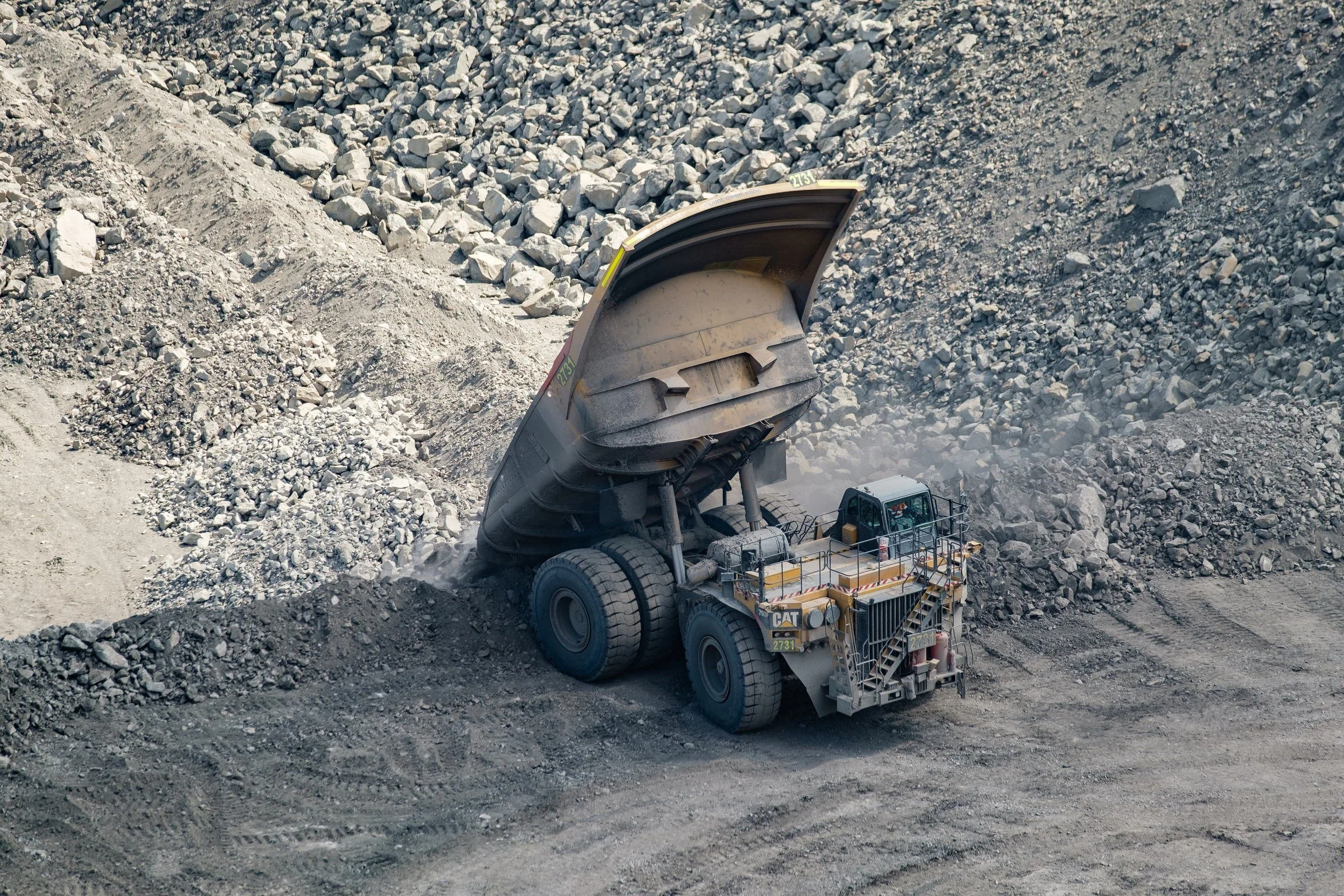 Haul truck photographed from above on an open-cut mine bench in NSW.