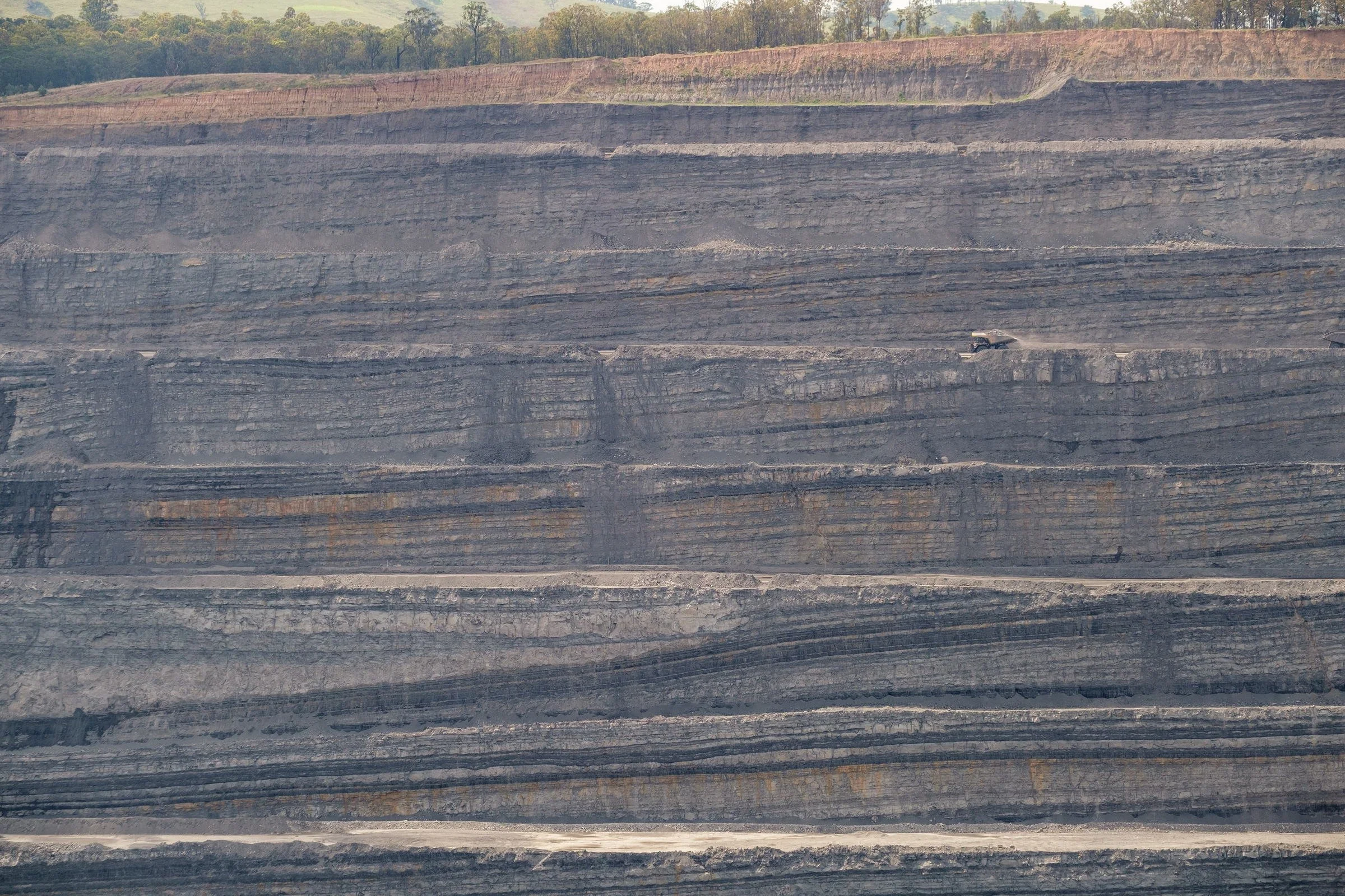Open-cut mine bench and highwall strata photographed for the NSW Resources Regulator image library.