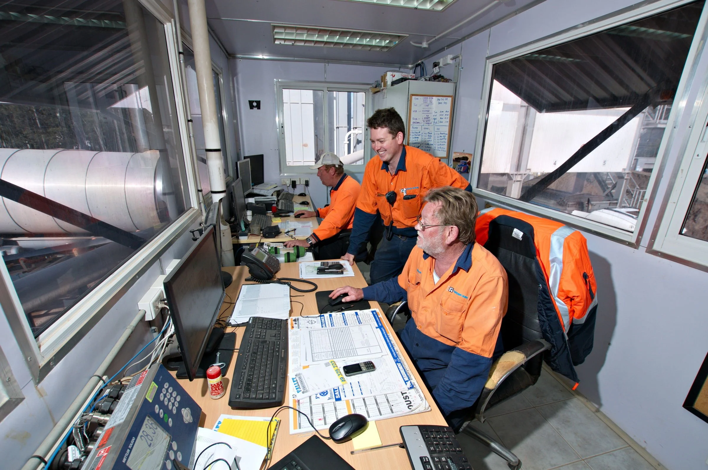 Fulton Hogan staff working in the asphalt plant control room