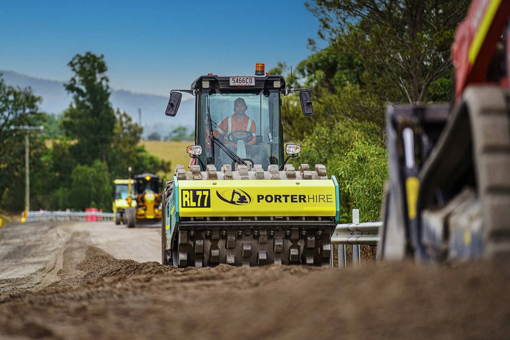 Road roller compacting pavement during road construction works in the Hunter region NSW