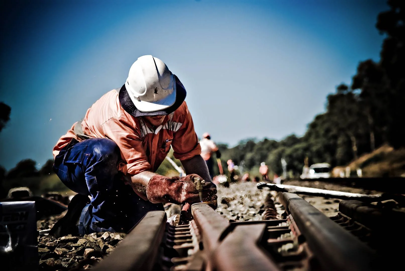 Rail worker carrying out track maintenance on railway infrastructure in NSW