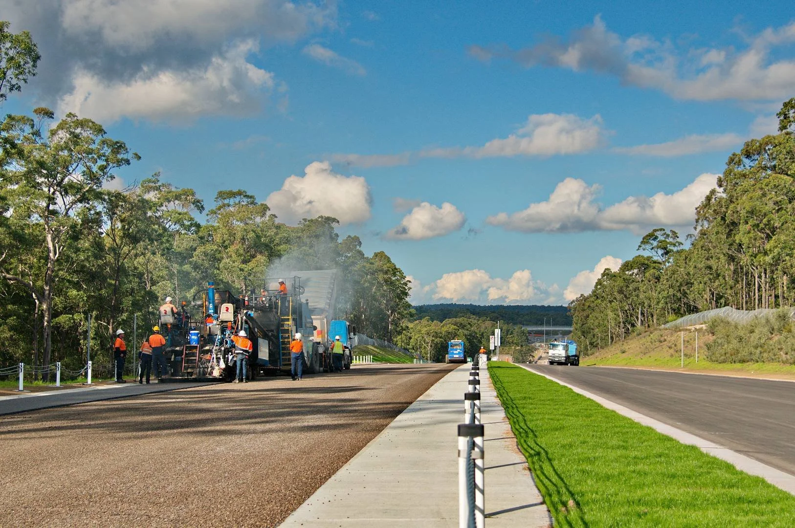 Road construction crew and paving equipment working on new roadway in the Hunter region NSW
