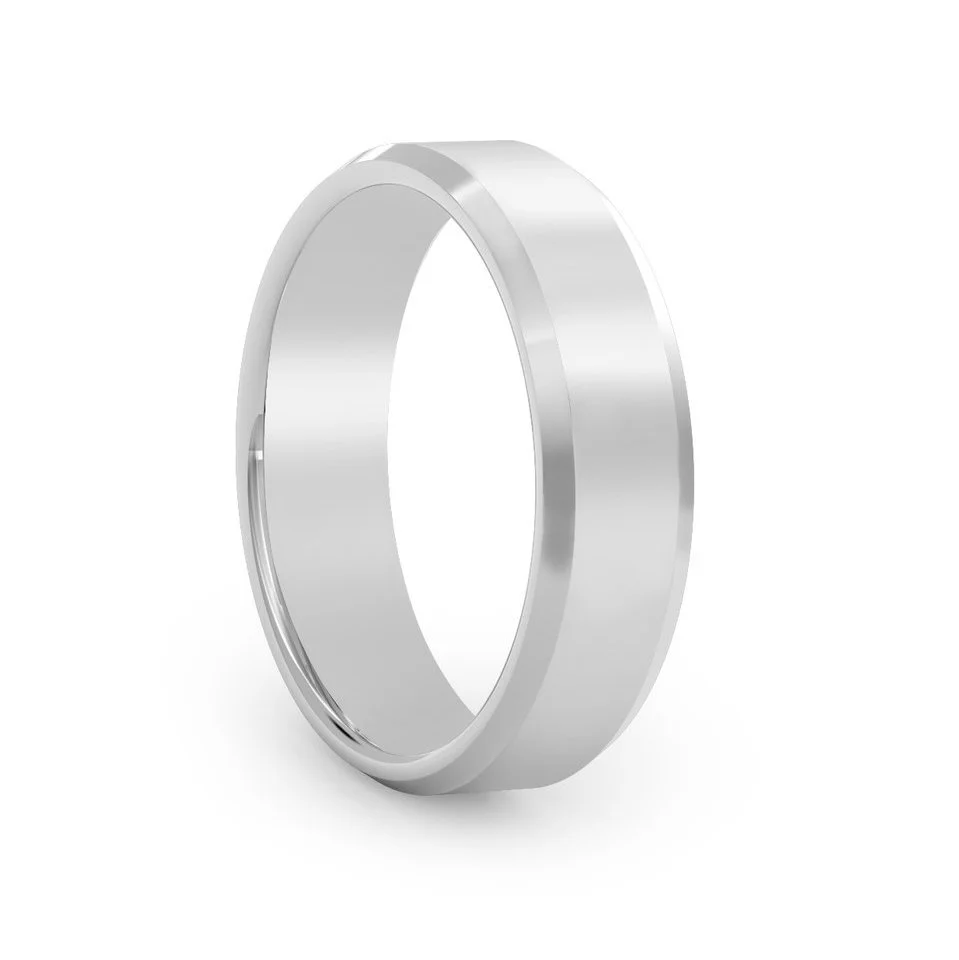 Beveled edge wedding ring. Handmade in our jewellery shop in London.