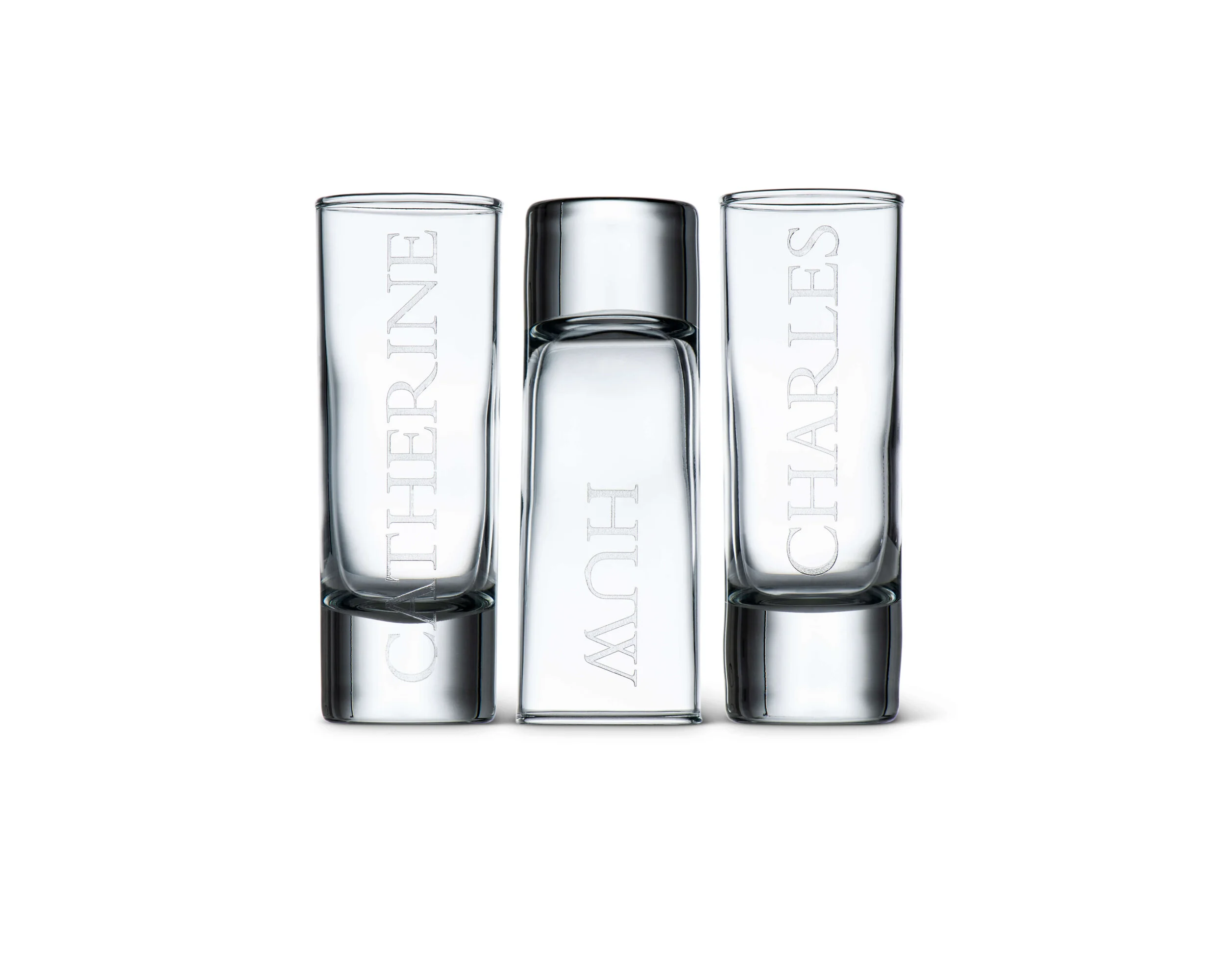 Set of three transparent glass vases engraved with the words 'CHIERINÉ', 'KYOH', and 'CHIERINÉ' engraved vertically on each, arranged on a white background.