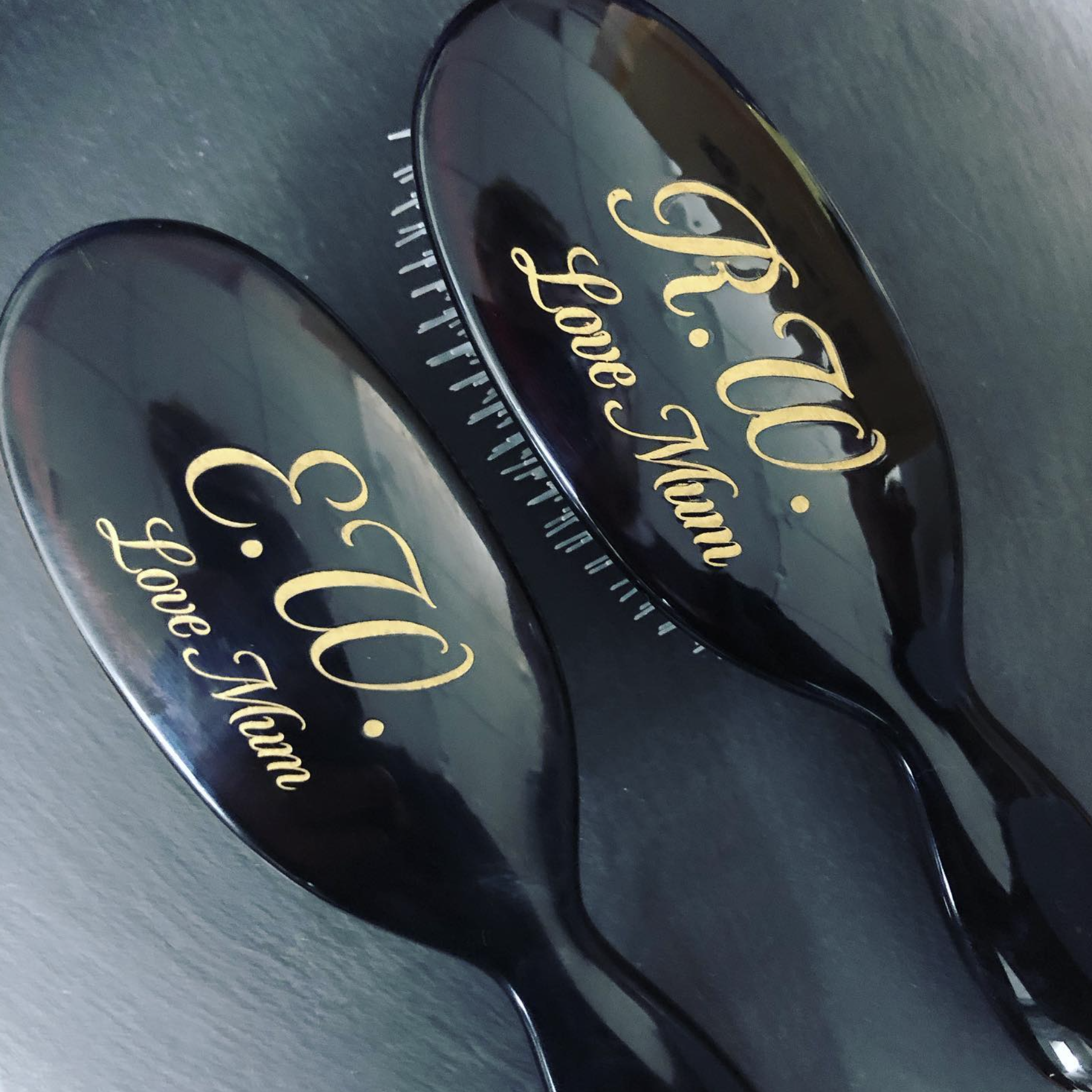 Engraved hair brushes that have been hand-filled with gold wax to make the engraving 'pop'.