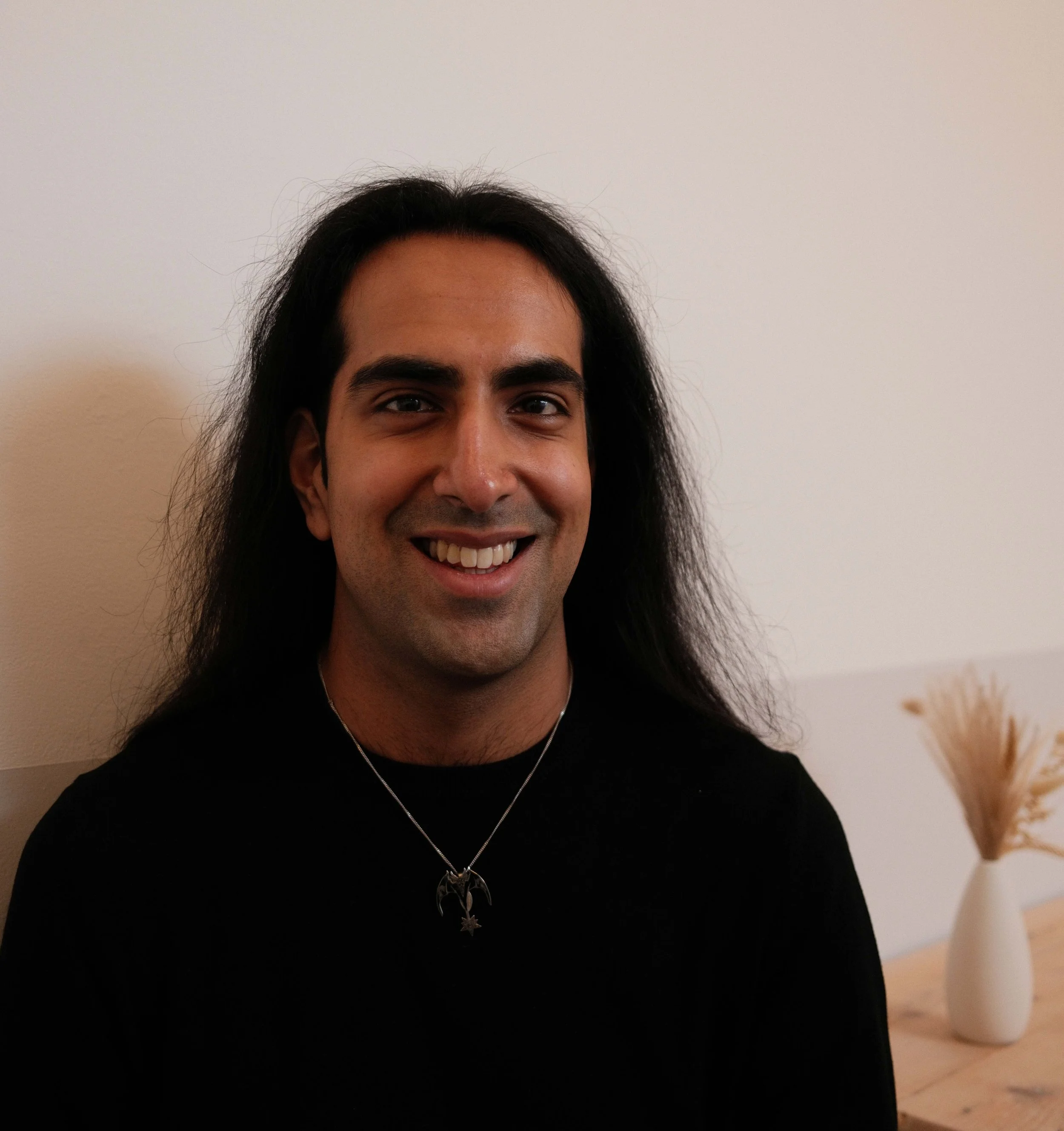 Headshot of Naail Kashif-Khan