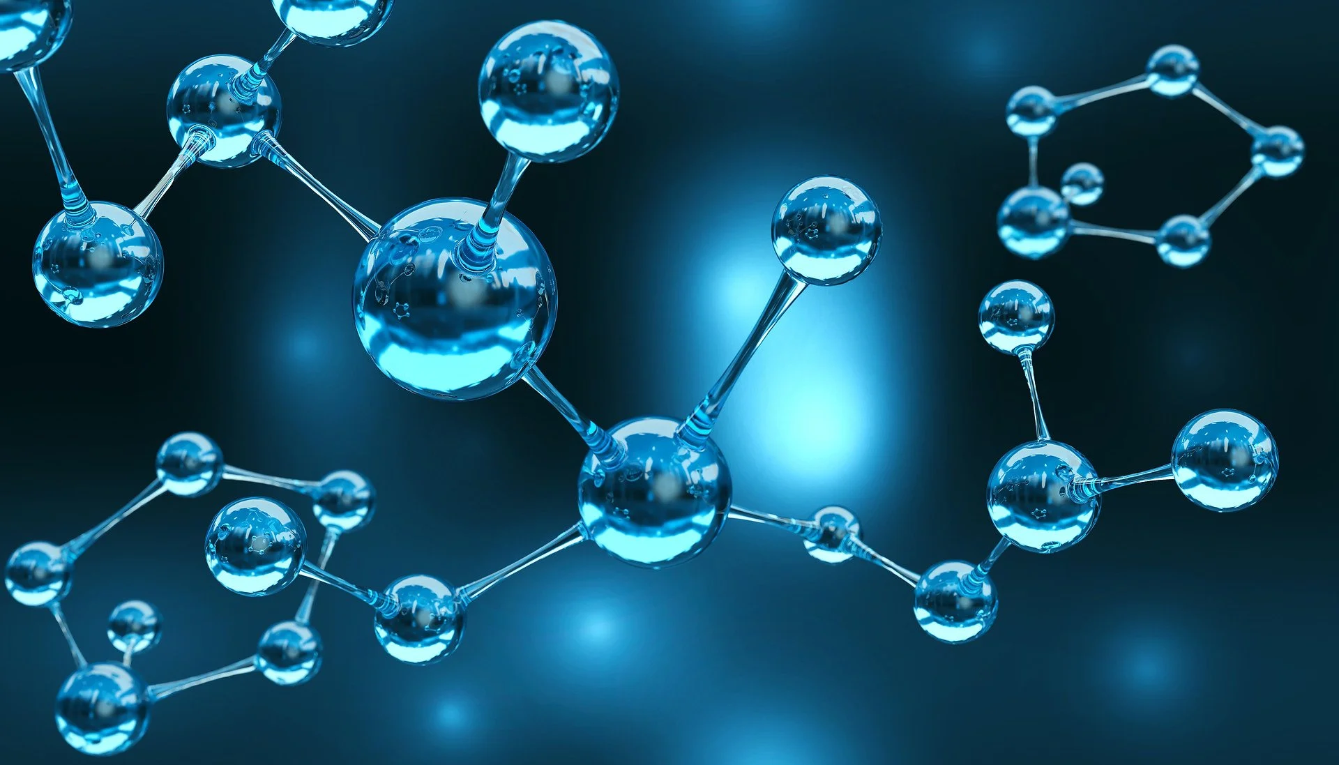 A digital illustration of a molecular structure with interconnected blue spheres and rods on a dark background.