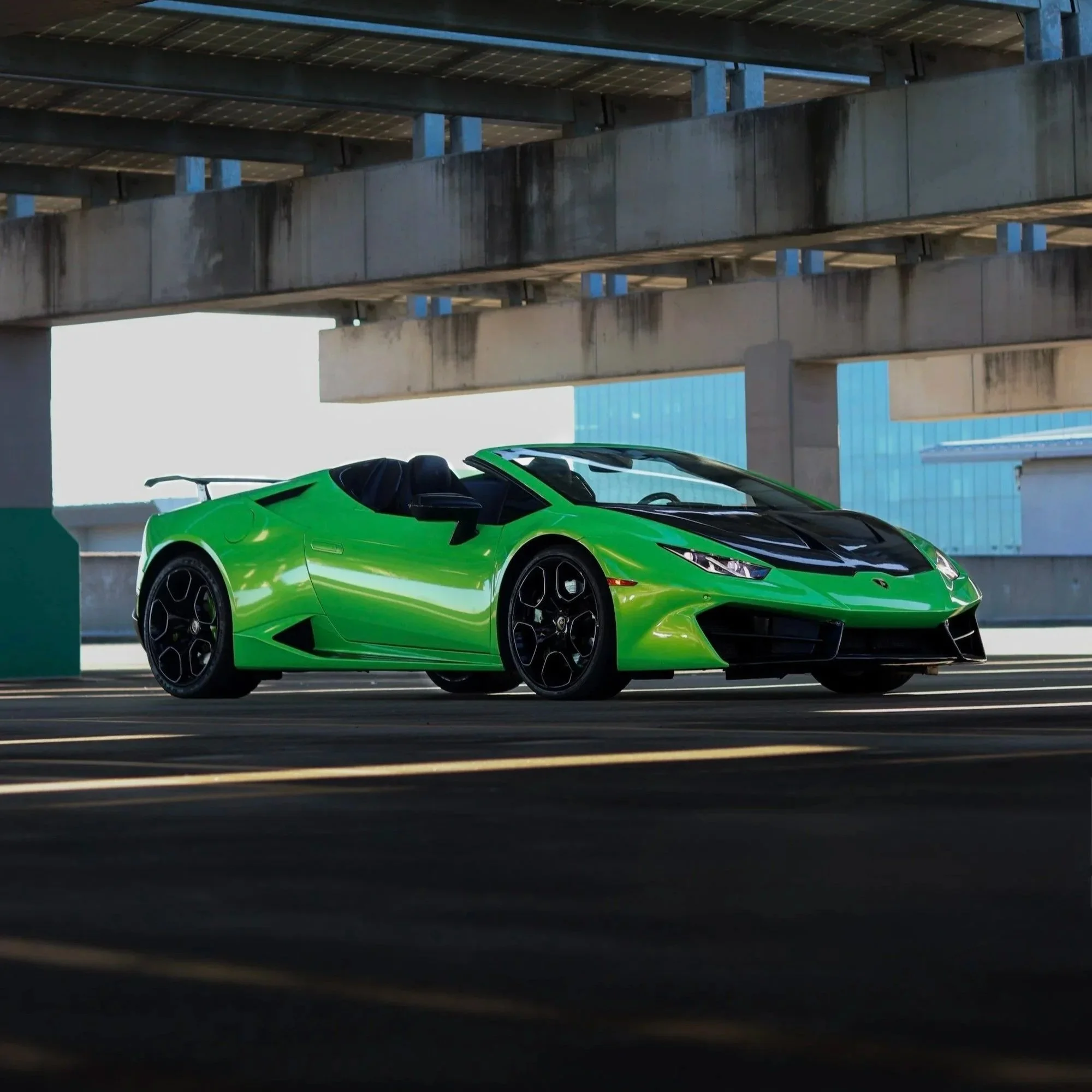 Green 2019 Lamborghini Huracan Spyder front view, exotic convertible rental in Tampa, Florida.