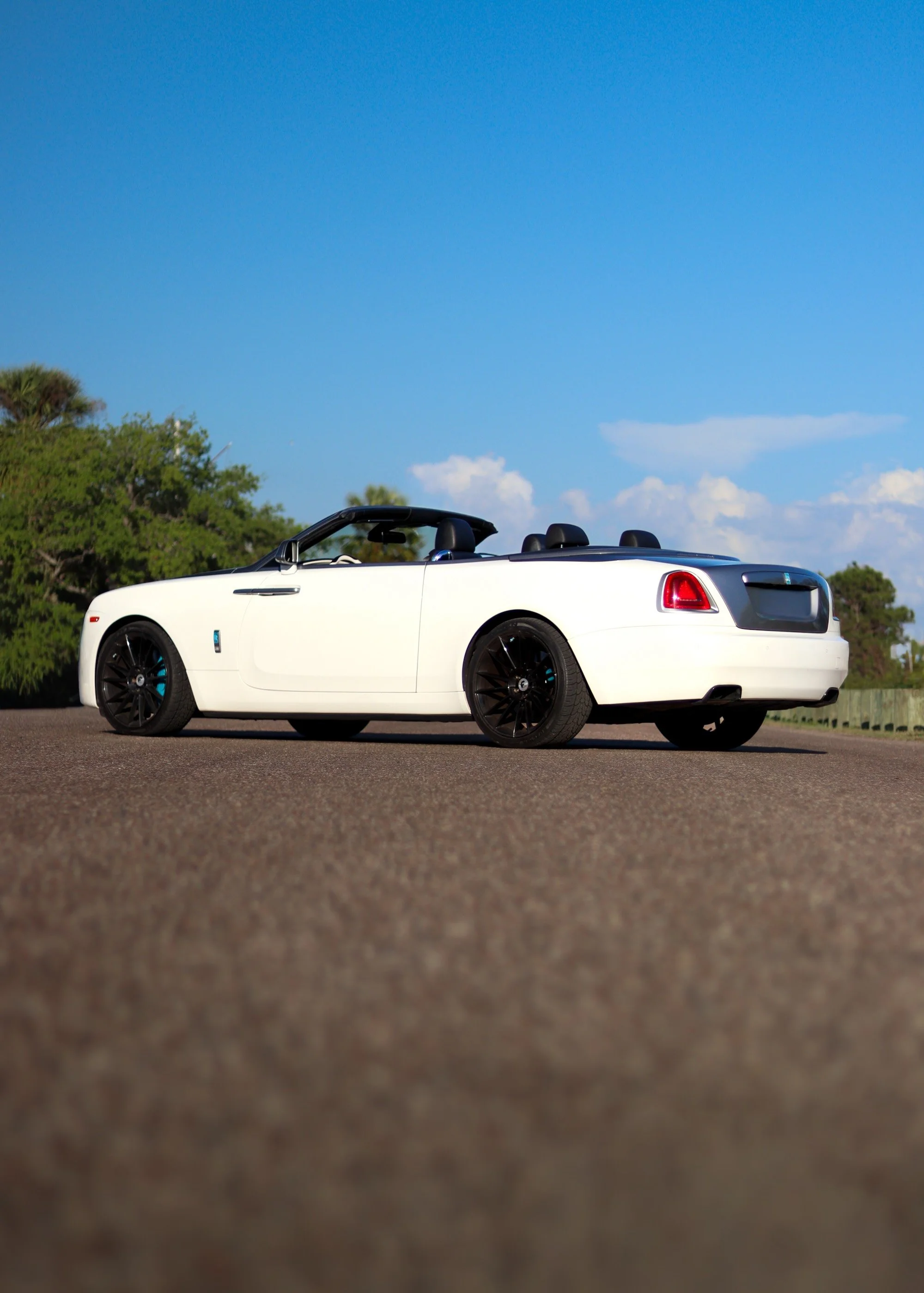Side profile of white Rolls-Royce Dawn convertible in Tampa Florida
