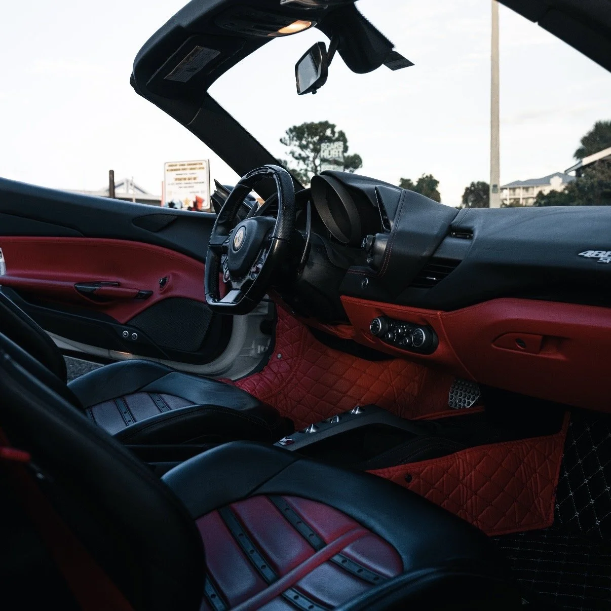 Ferrari 488 Spyder red interior cockpit luxury supercar rental