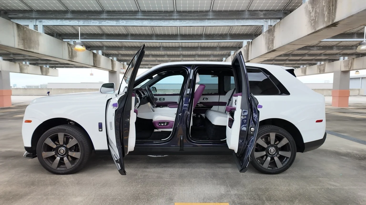 Rolls Royce Cullinan with signature coach doors open showcasing luxury interior in Tampa