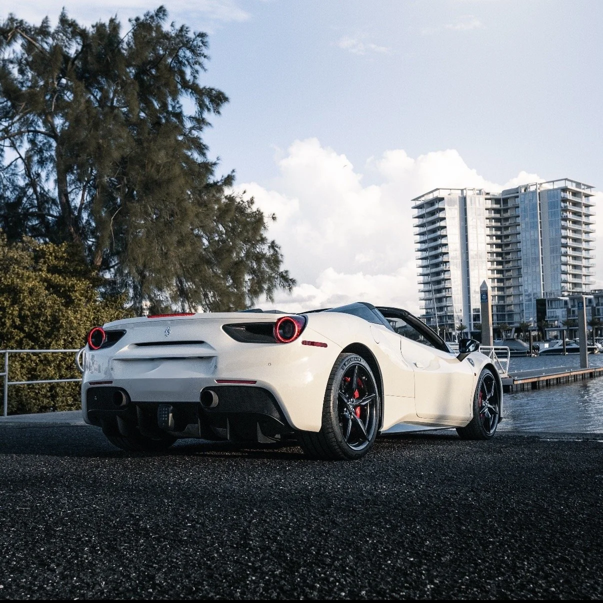 Rear view of white Ferrari 488 Spyder exotic car rental Tampa Florida