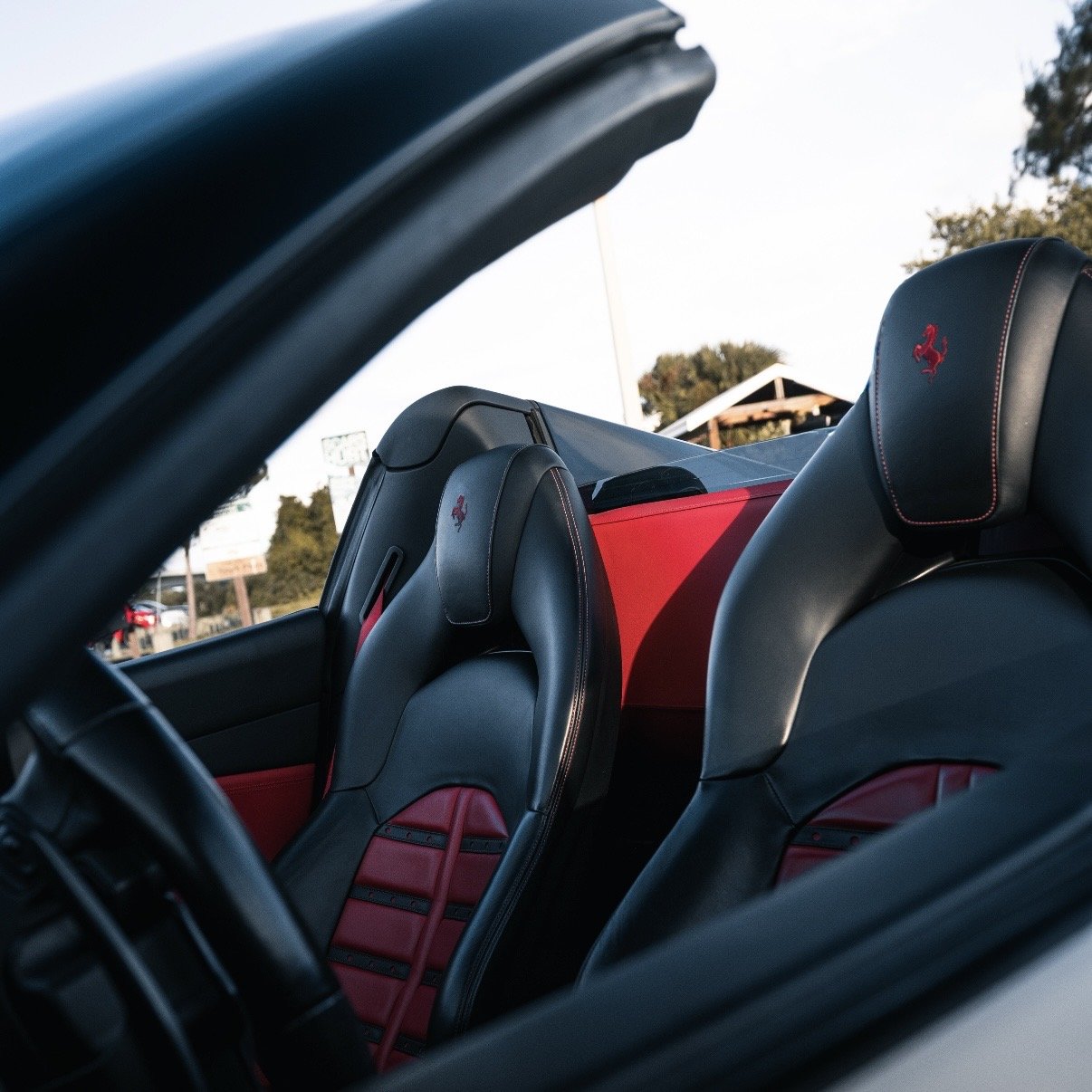Red and black Ferrari 488 Spyder interior luxury supercar rental