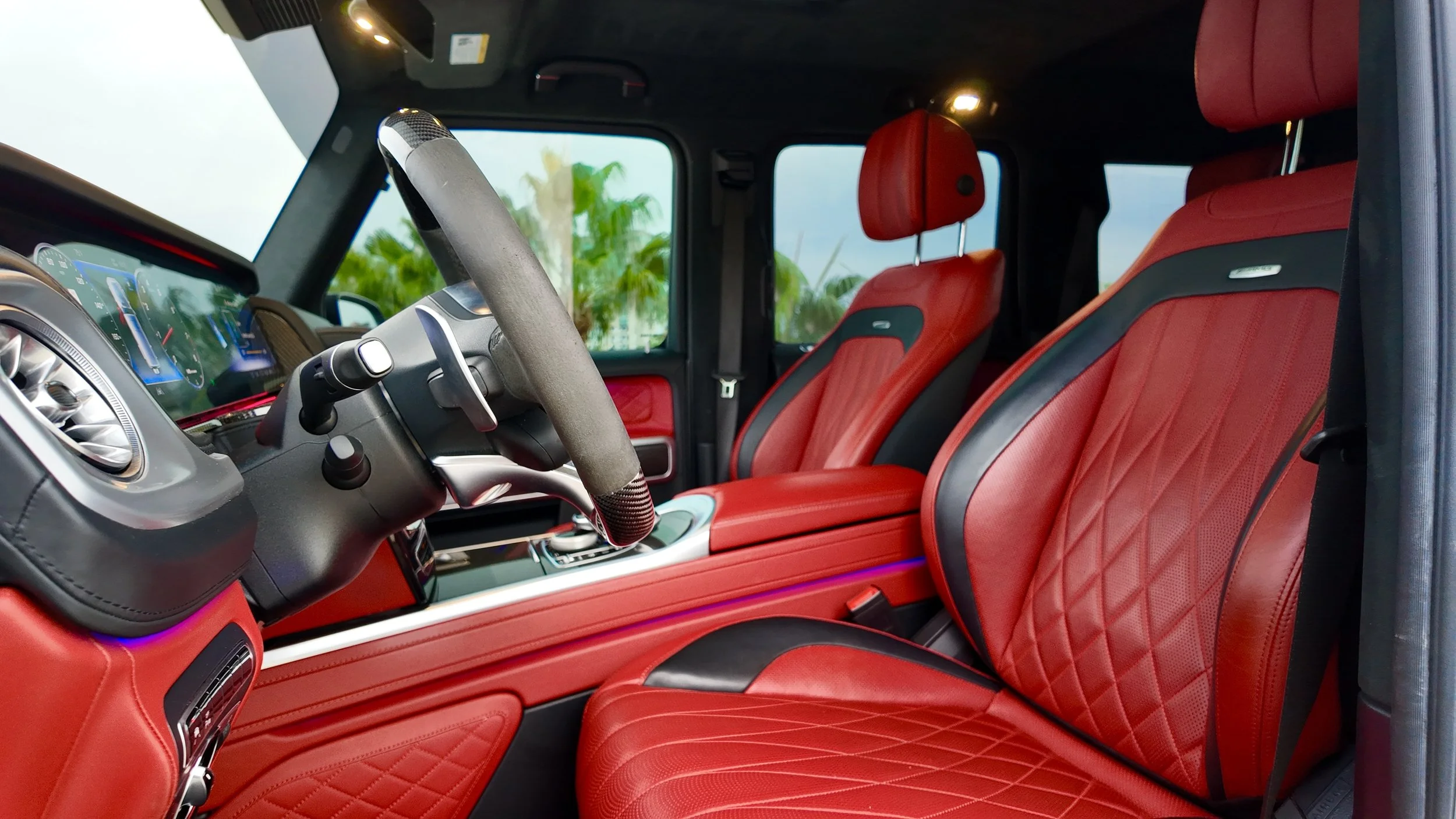 Red leather interior of a Mercedes G63 AMG G-Wagon luxury SUV rental in Tampa
