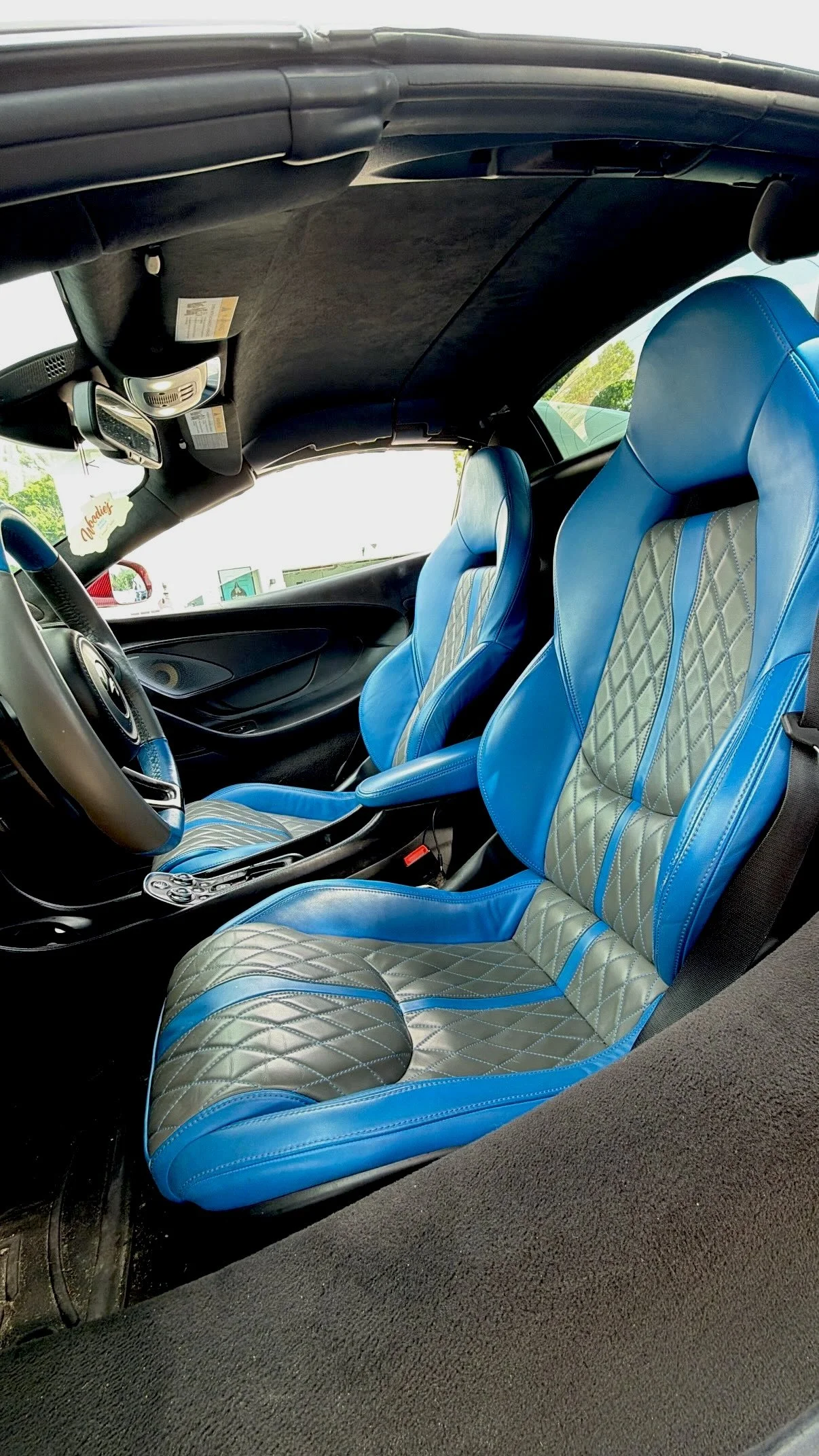 Blue leather seats inside McLaren 570S Spyder luxury interior