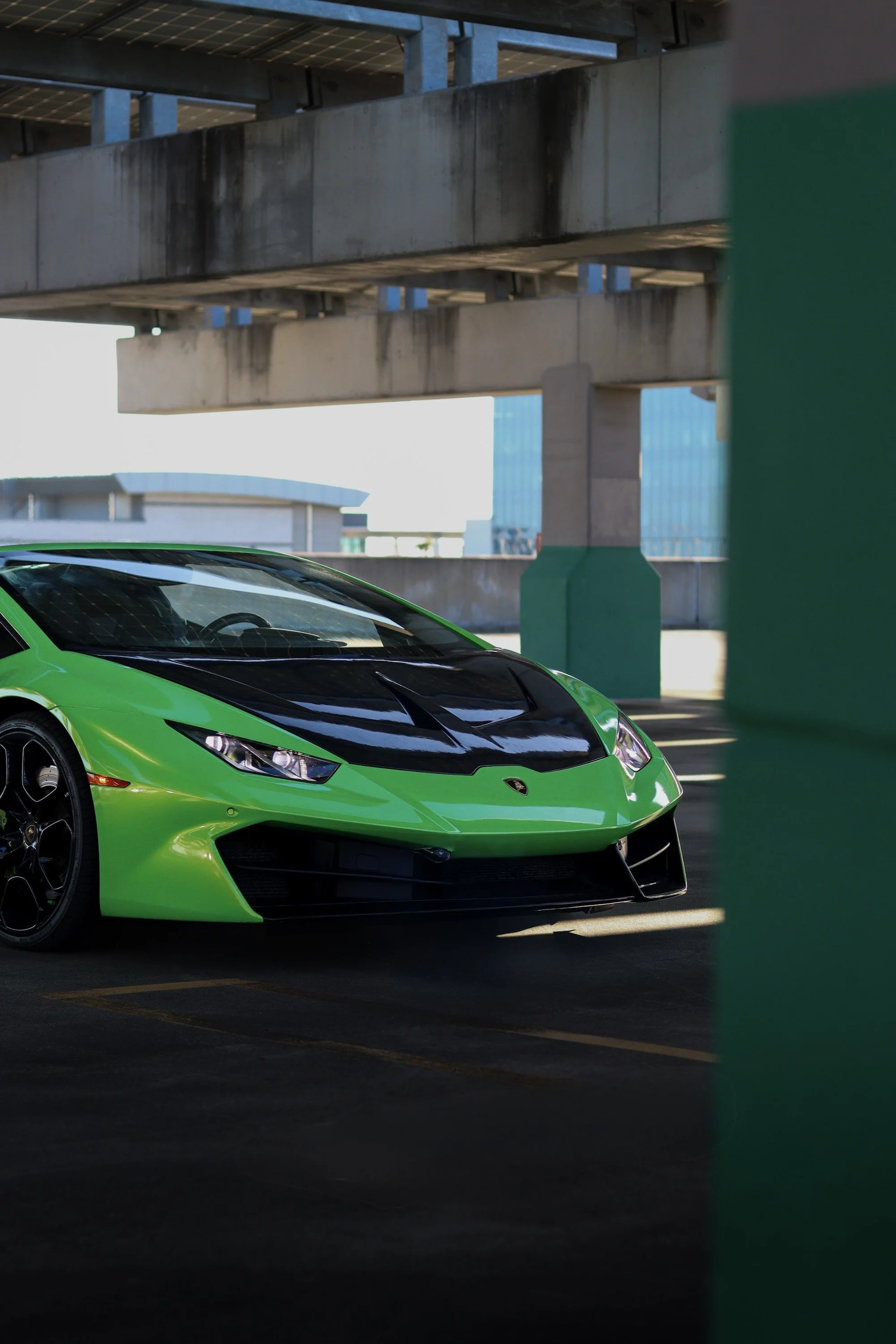 Green 2019 Lamborghini Huracan Spyder convertible rental in Tampa, Florida.
