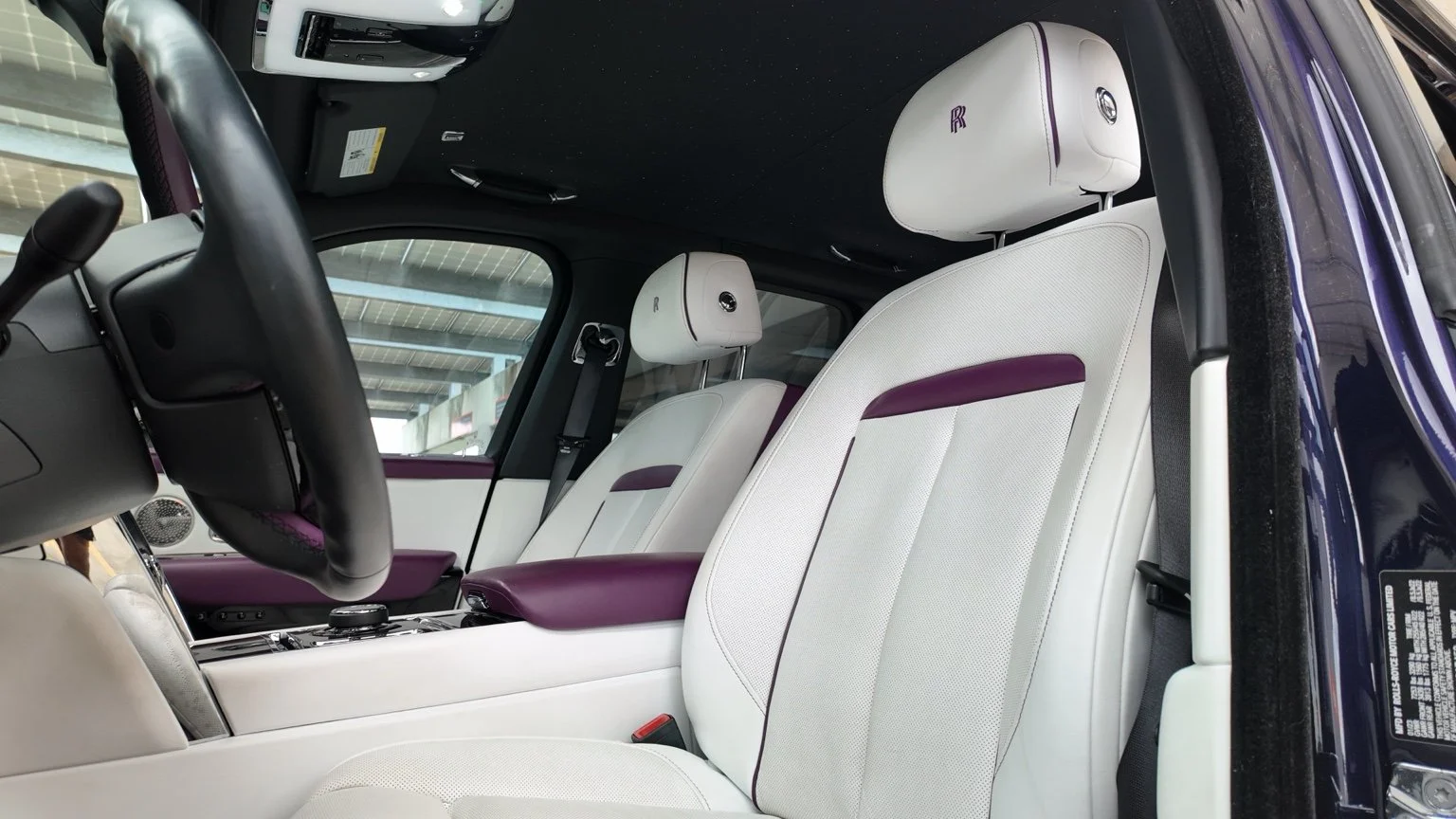 Rolls Royce Cullinan white leather seats with starlight headliner and purple accents