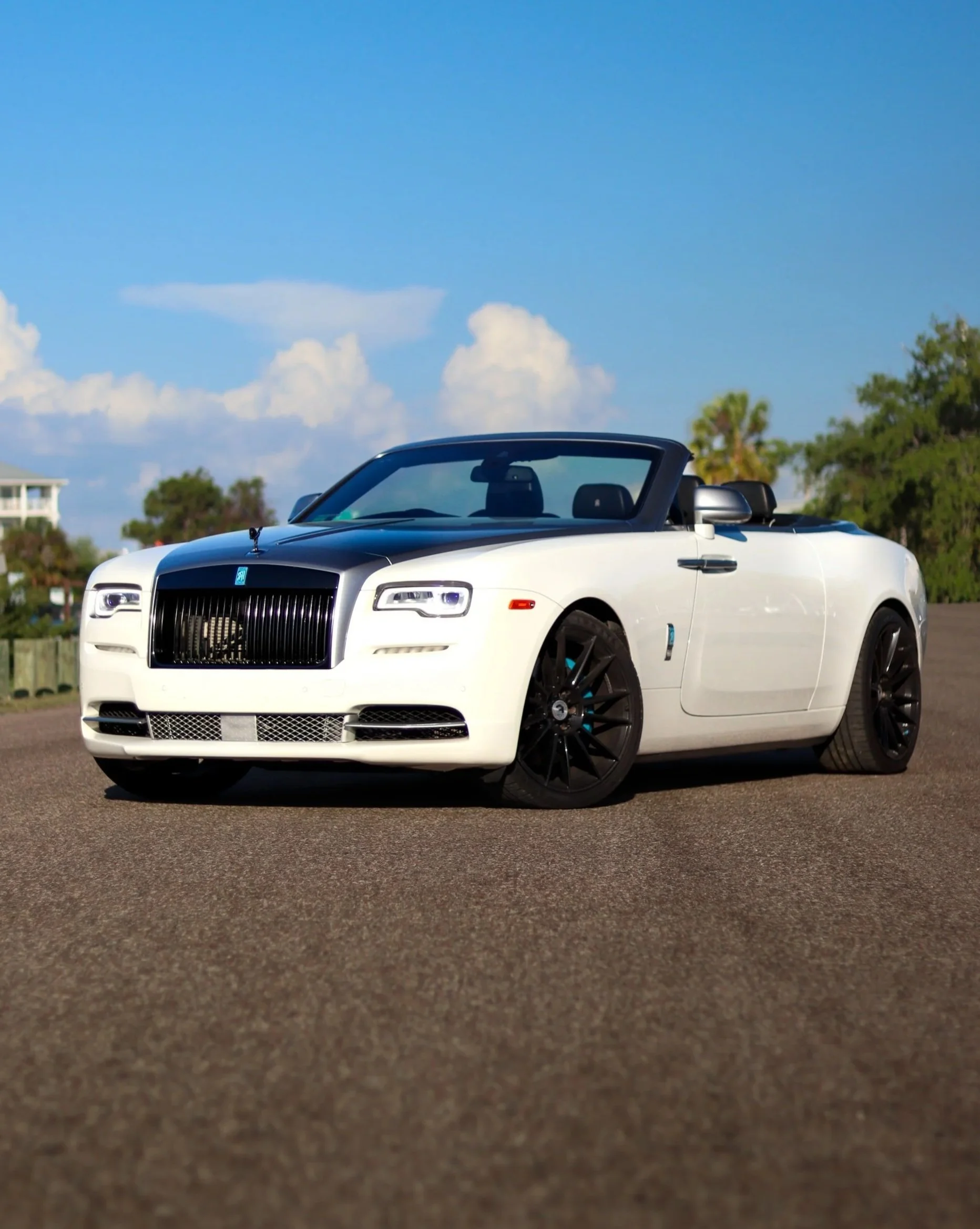 White Rolls Royce Dawn convertible luxury car rental in Tampa with black accents