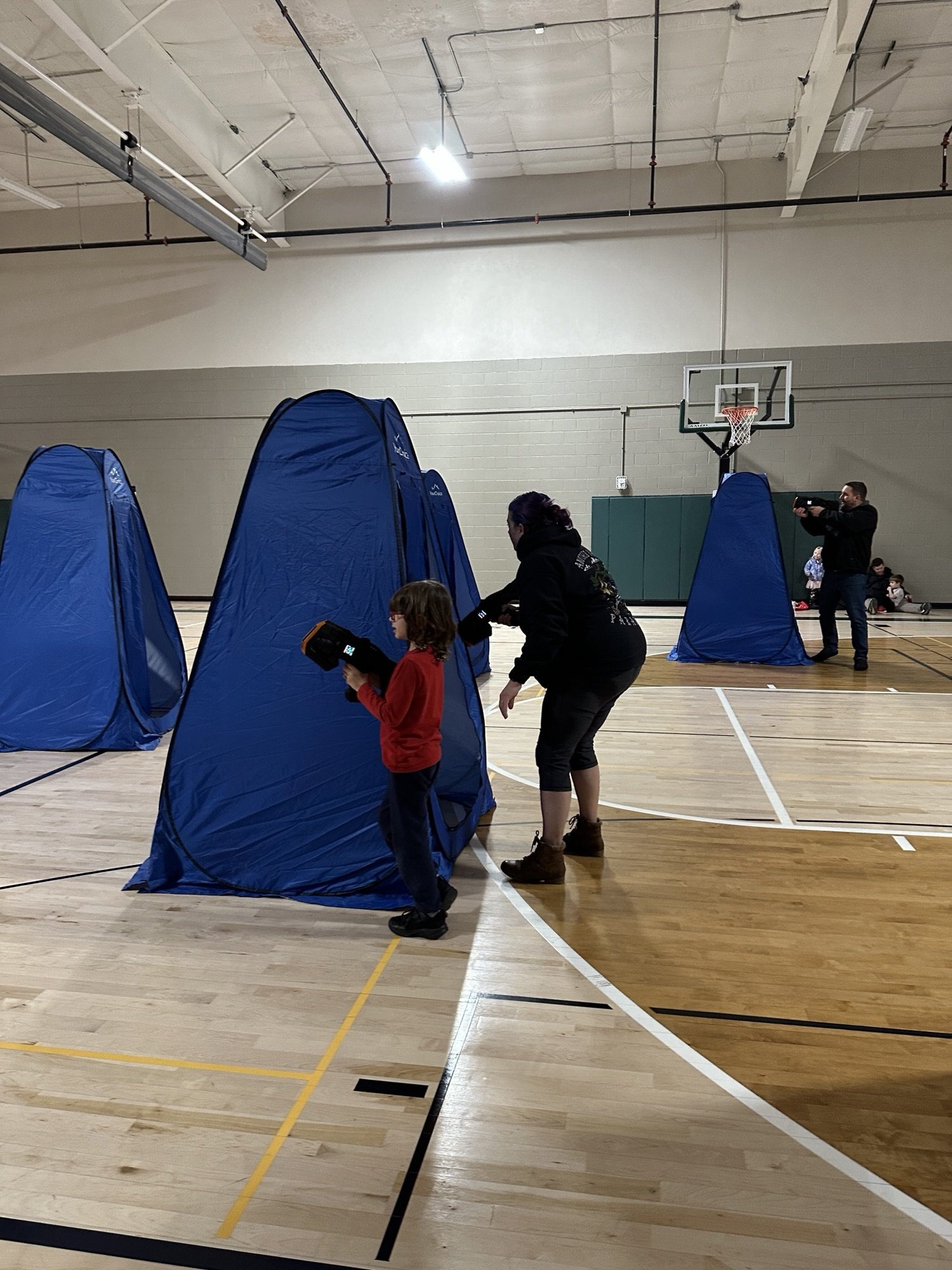 parent-and-child-playing-laser-tag-together.jpg