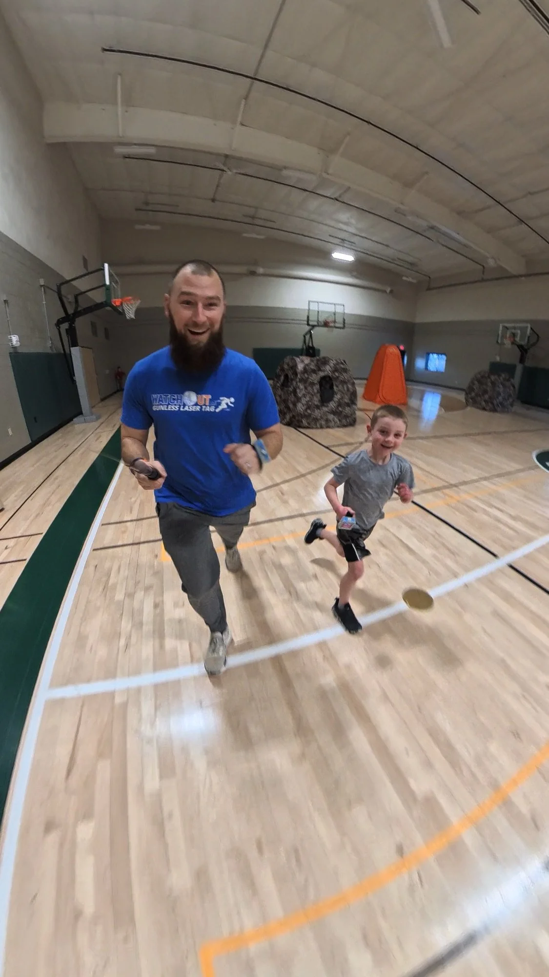 pe-teacher-eric-running-ztag-game-with-kid.jpg