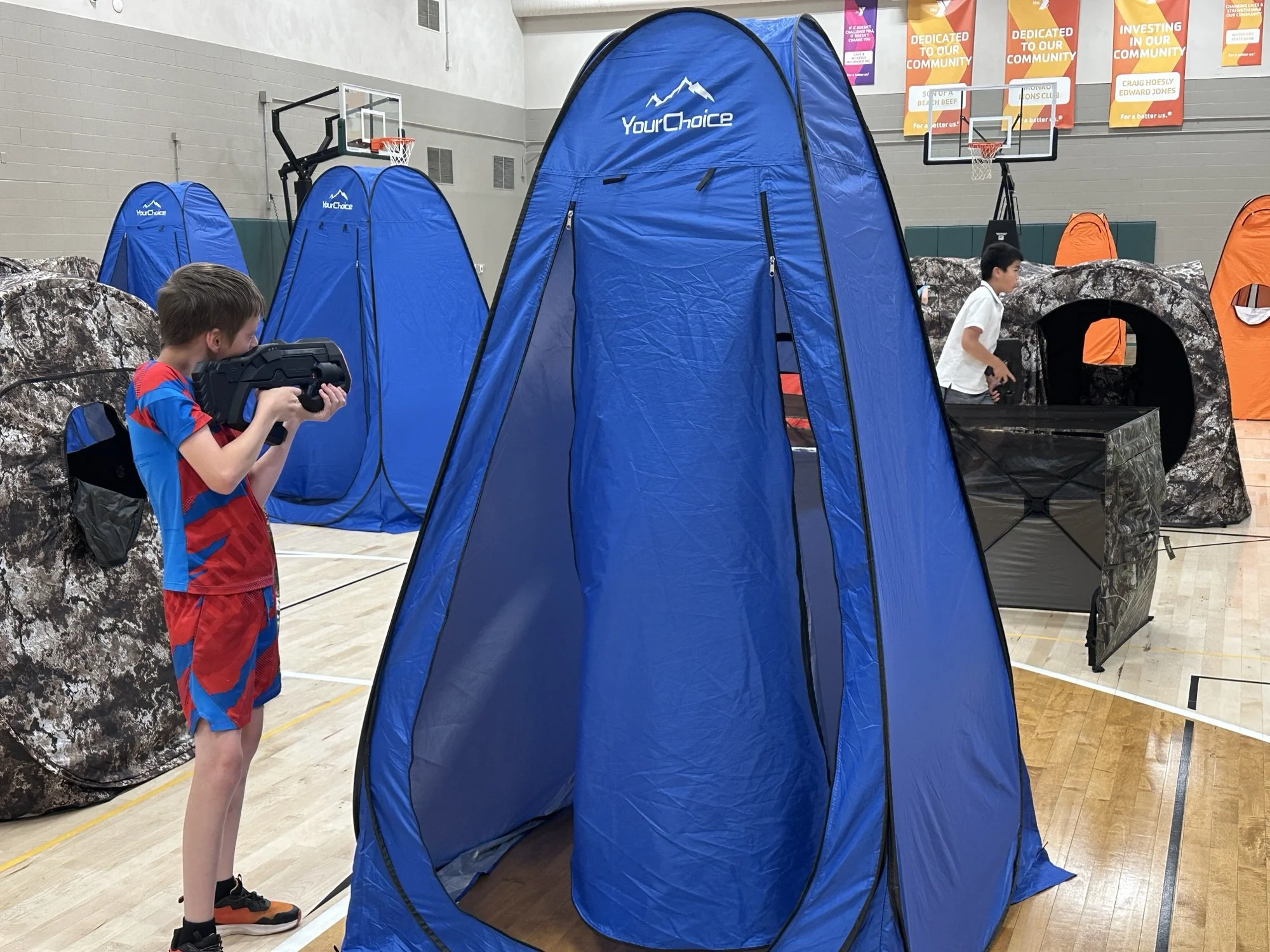 kid-playing-traditional-laser-tag-birthday-party-gym.jpg