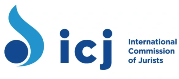 Logo of International Commission of Jurists. In the centre is "icj" in a large dark blue font with "International Commission of Jurists" in smaller font on the right. On the left is a dark blue circle and light blue wavy line.