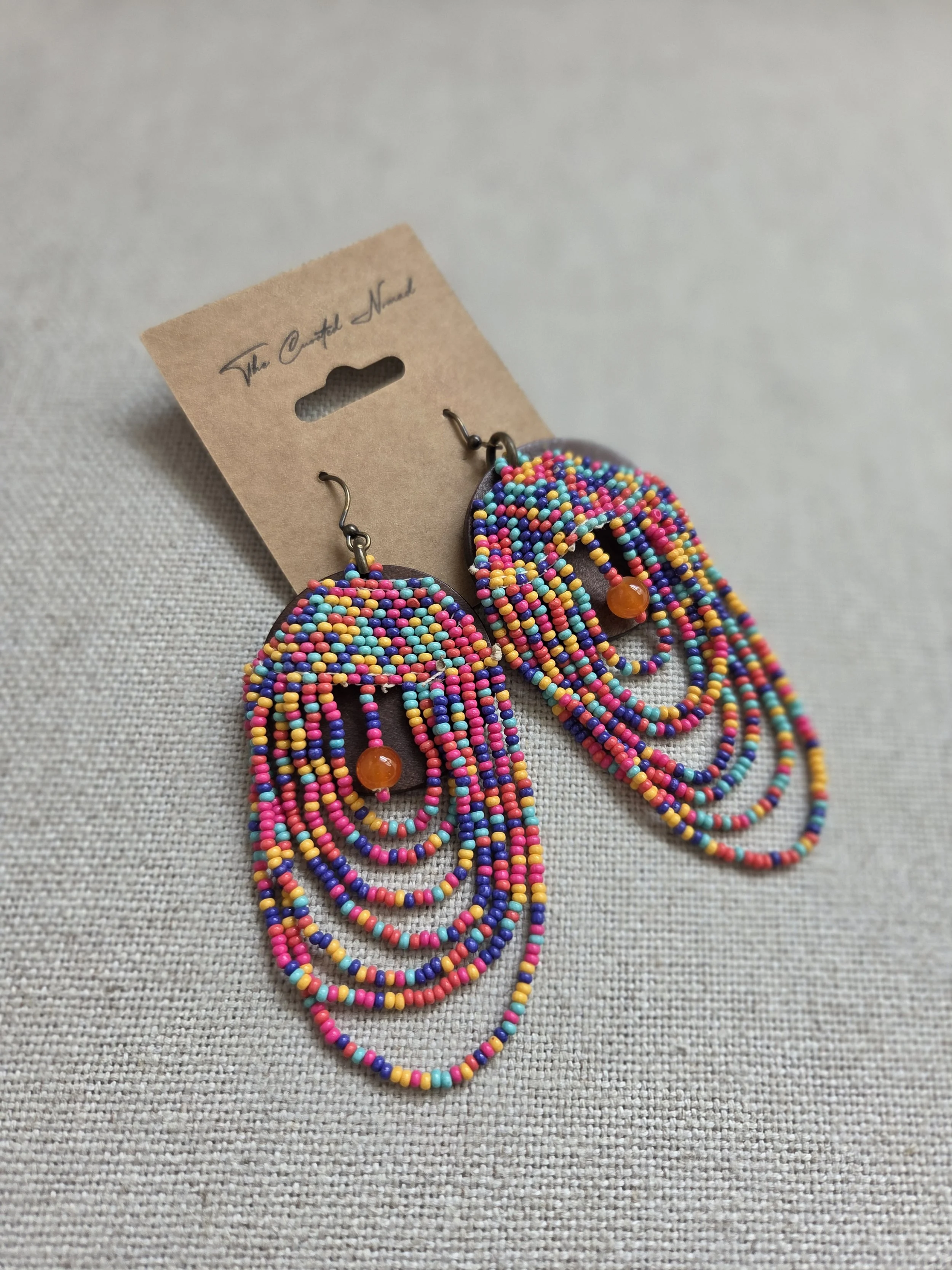 Wood disc with seed beads