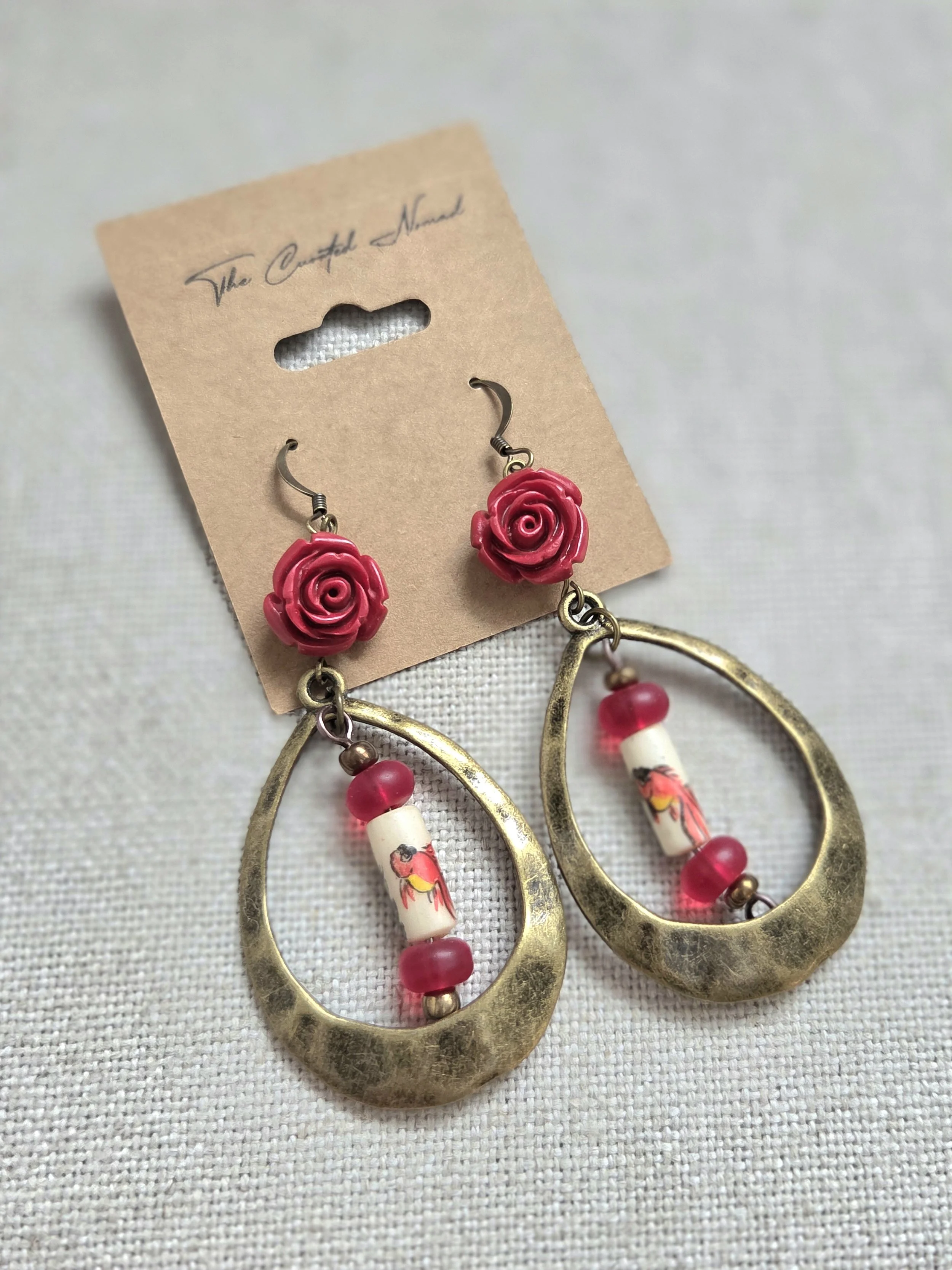 Painted goldfish on bone with brass hoops and frosted czech glass