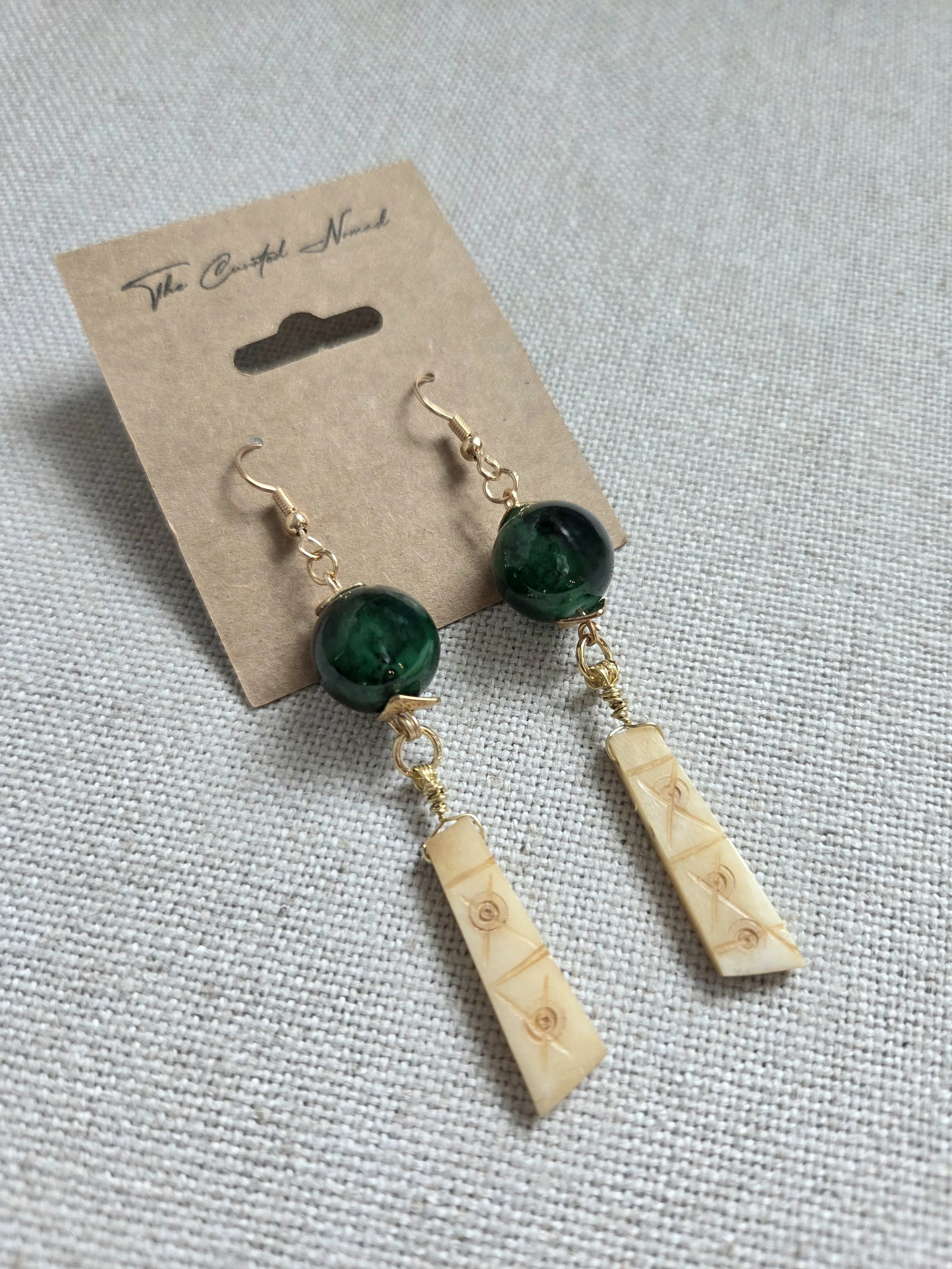 Vintage etched bone with glass bead