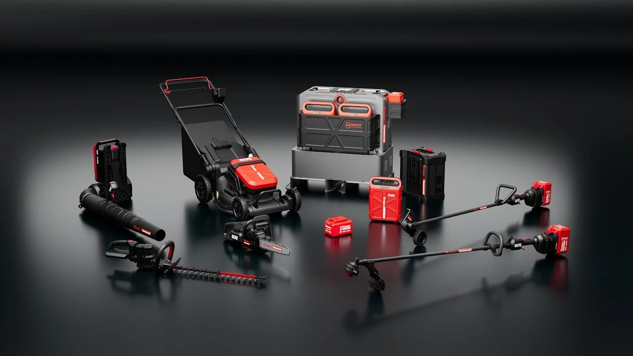 Collection of red and black Milwaukee power tools and equipment on a black surface against a black background.