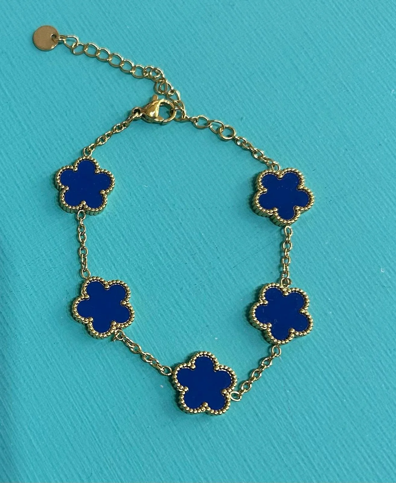 fiori base oro e fiore blu.jpg