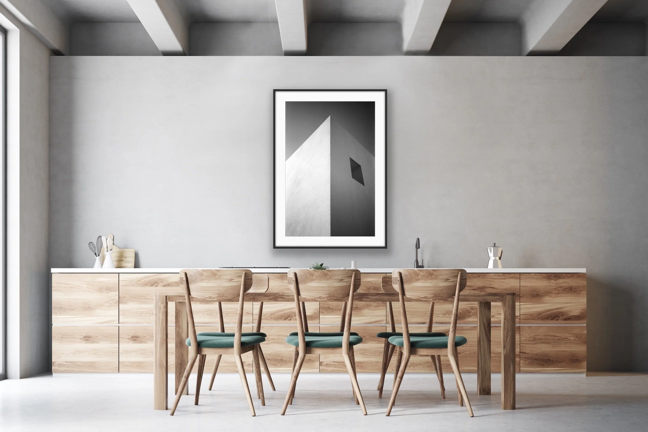 Modern minimalist dining area with a wooden table and six chairs, a sideboard, and abstract black and white artwork on a light gray wall.