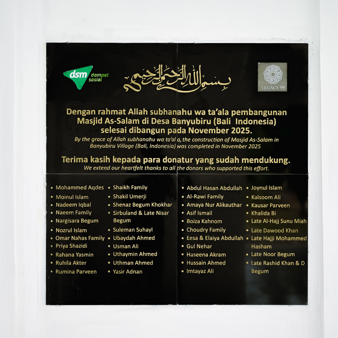 A black plaque with gold and white text detailing the completion of Masjid As-Salam in Banyubiru Village, Bali, Indonesia, in November 2025, with a list of donors' names and logos of DSM and Legacy 99.