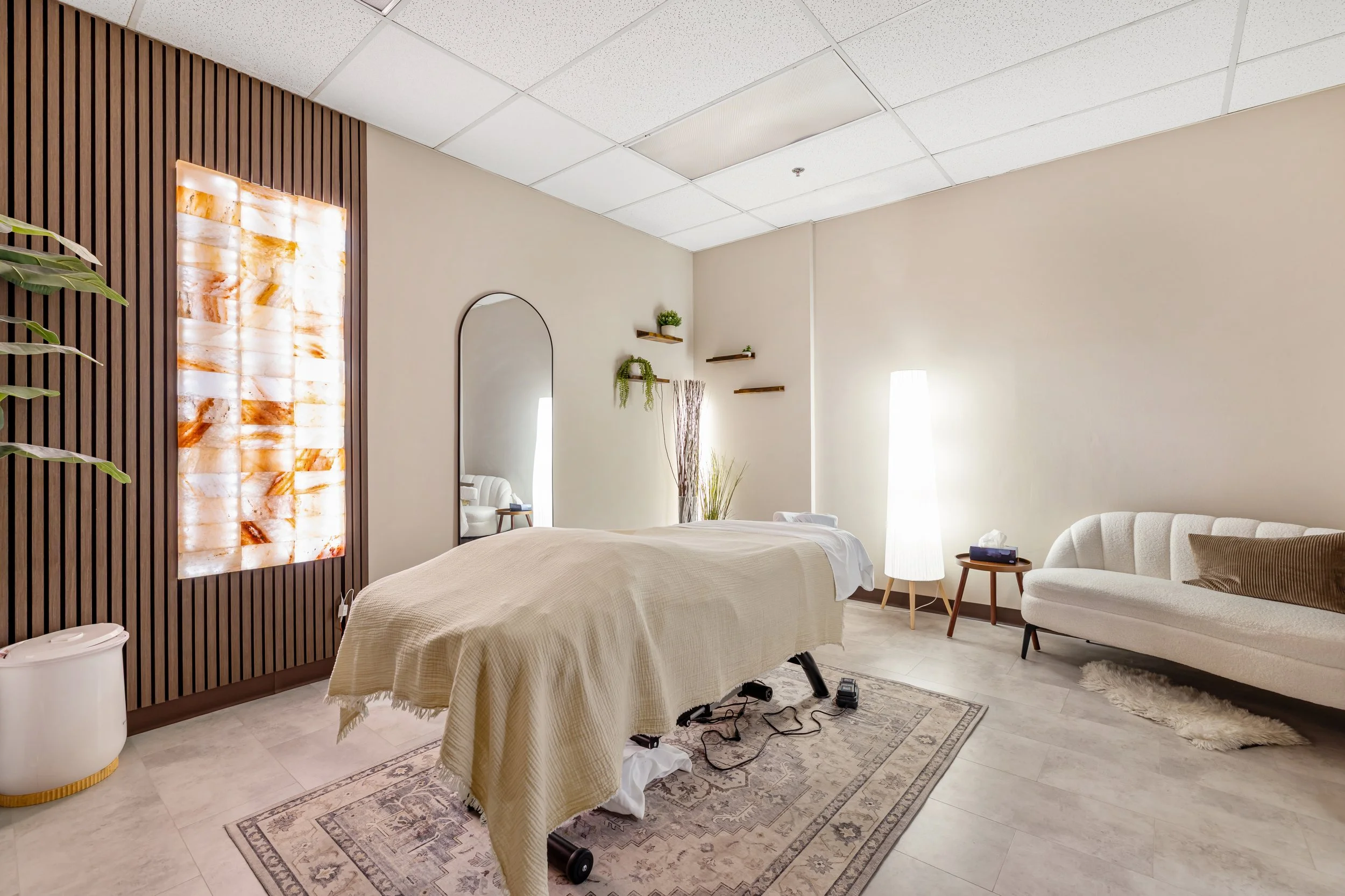 Warm and inviting treatment room at Lumera Health Collective, designed to create a calm, grounding environment for holistic care and hands-on therapy.