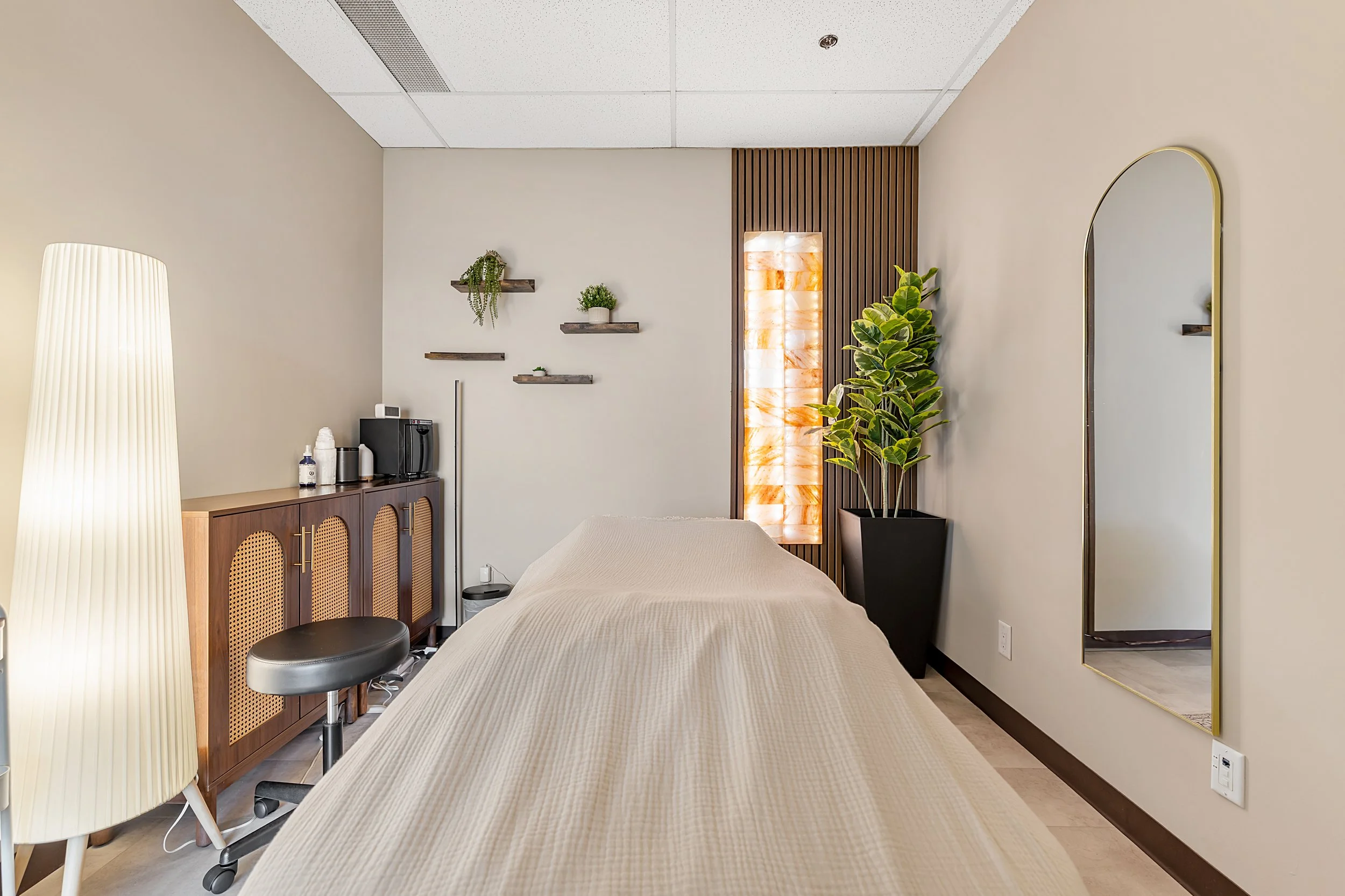 Warm and inviting treatment room at Lumera Health Collective, designed to create a calm, grounding environment for holistic care and hands-on therapy.