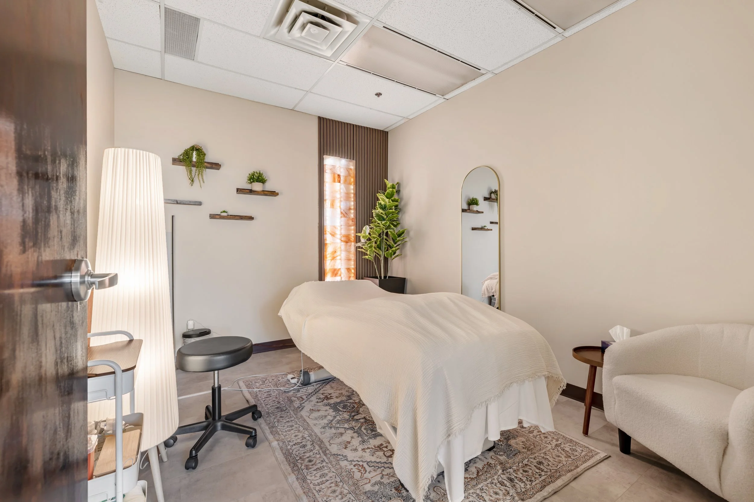 Warm and inviting treatment room at Lumera Health Collective, designed to create a calm, grounding environment for holistic care and hands-on therapy.