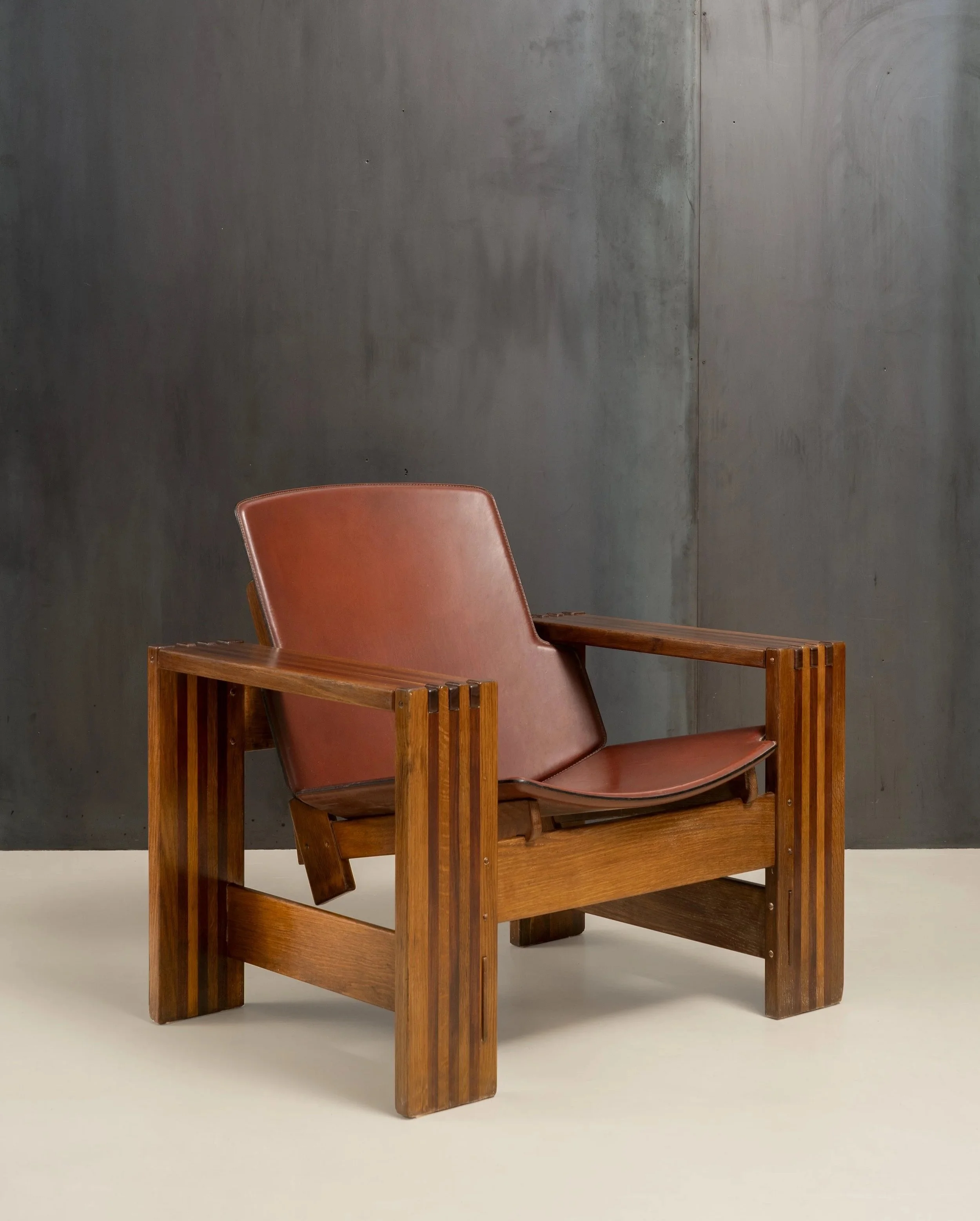 Rivadossi armchair, wood and leather. 1970s.