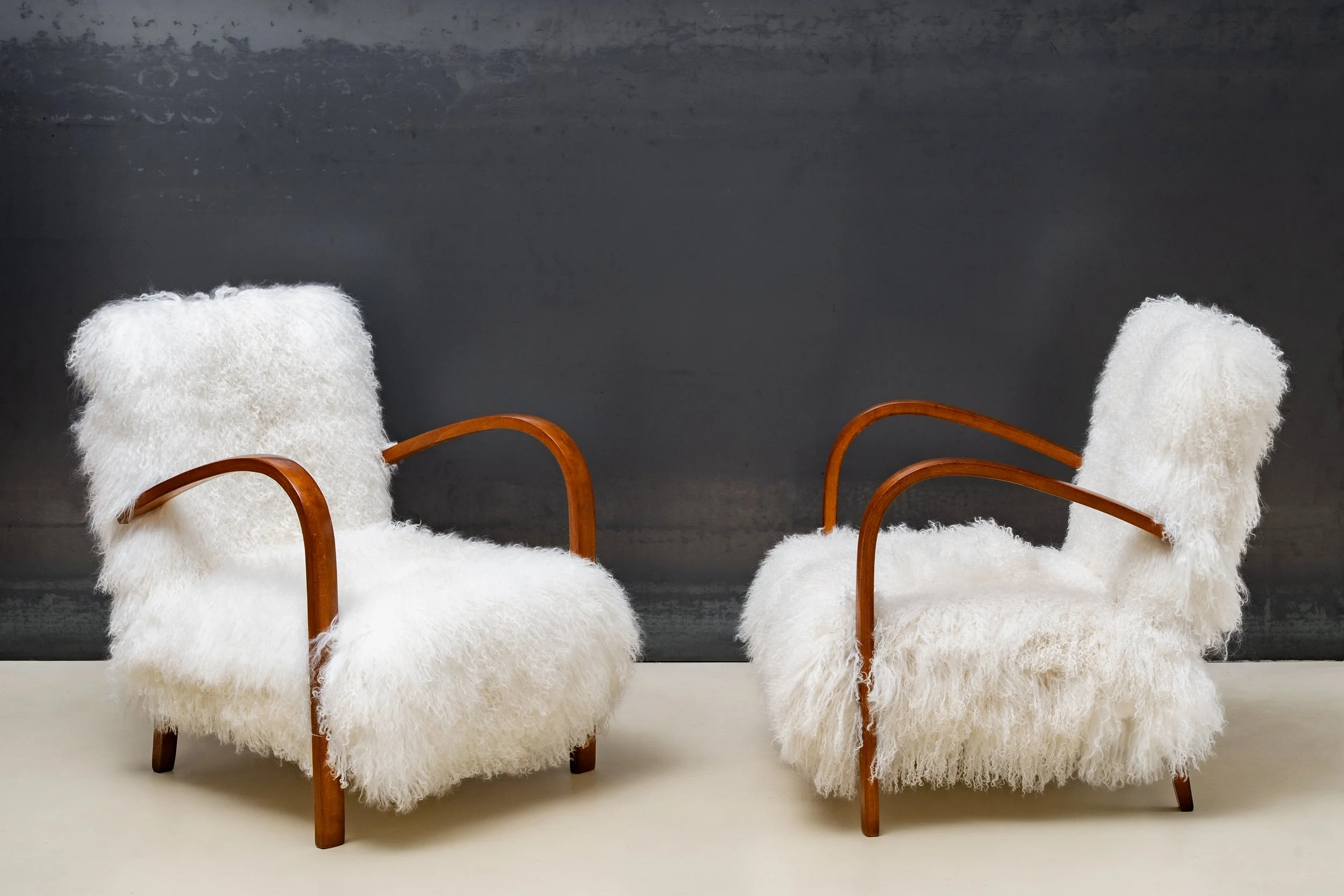 SOLD
Pair of wooden armchairs upholstered in Mongolian lamb fur, 1960s