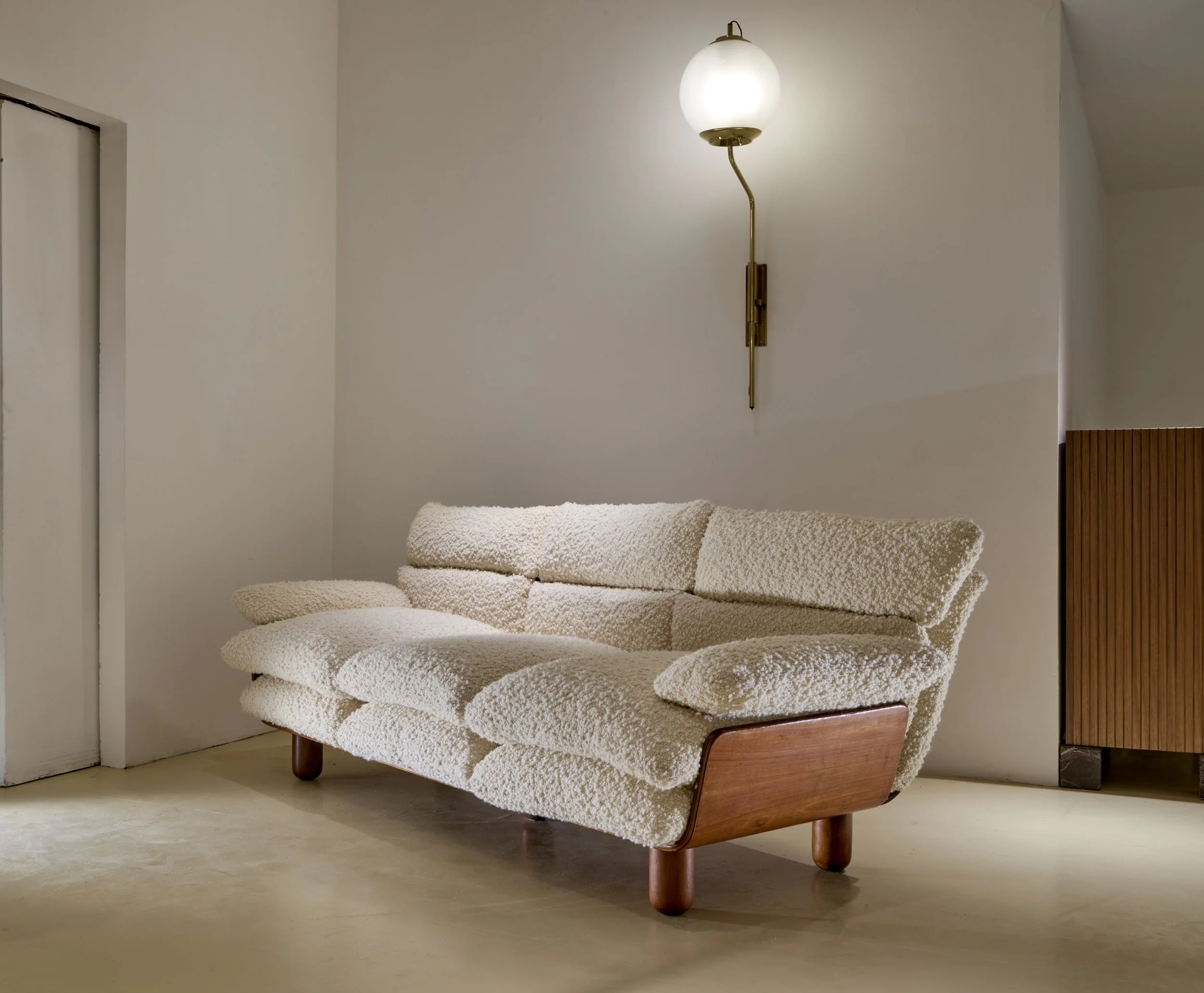 ofa in curved plywood and wool bouclé. Italian manufacture, 196