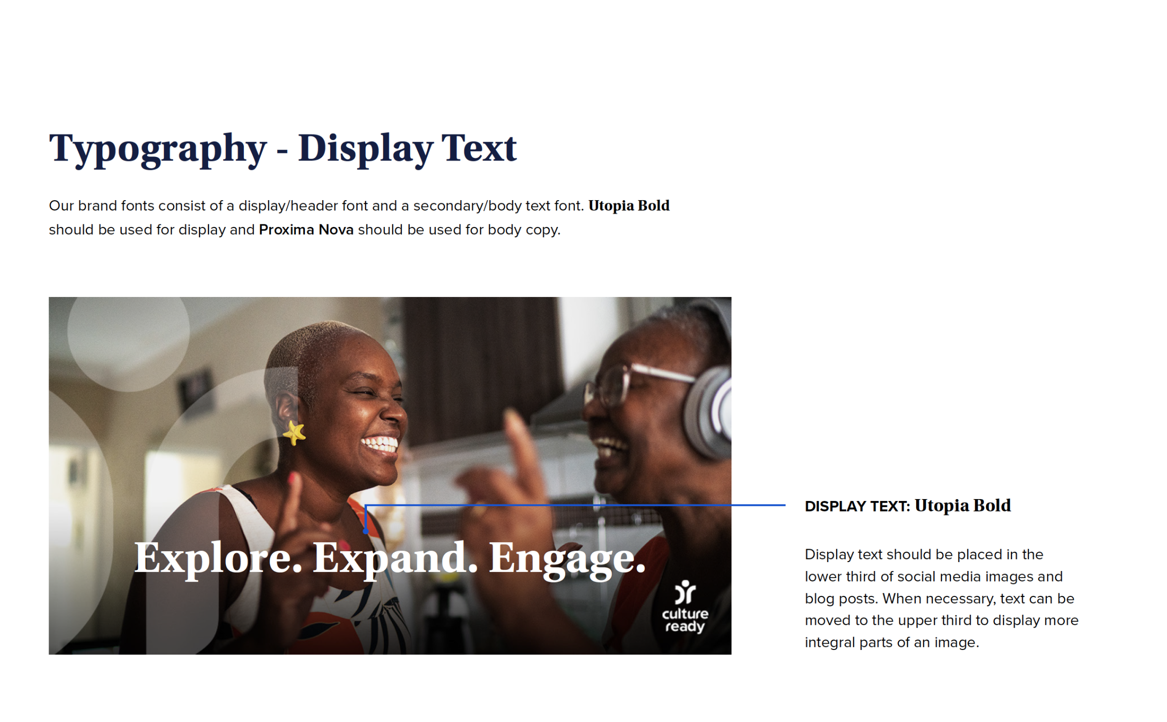 Two people smiling and engaging with each other, one wearing headphones and glasses, the other with short hair and earrings. Overlaid text reads, "Explore. Expand. Engage."