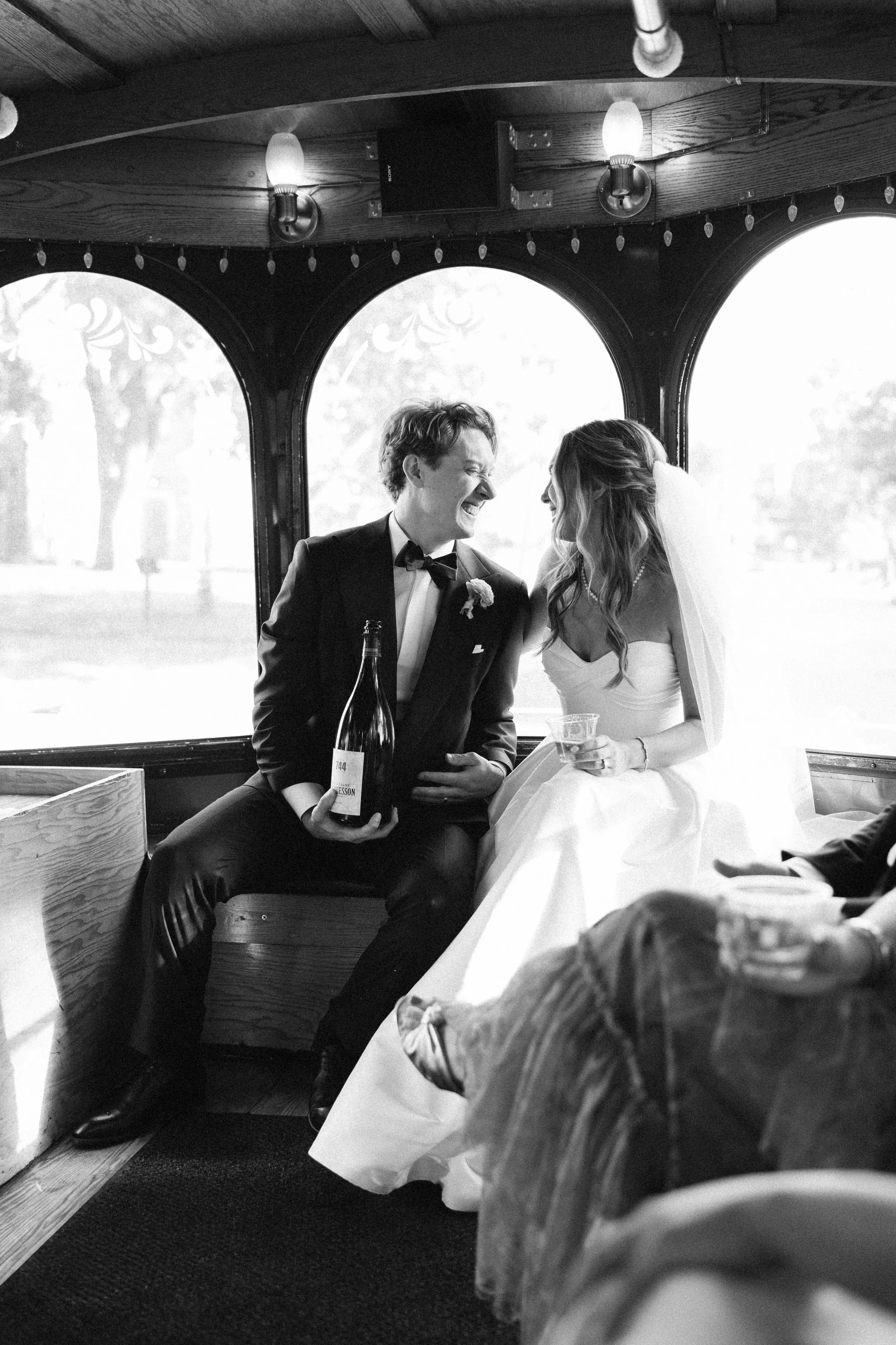 Groom smiles at bride on a trolly in Nashville, Tennessee