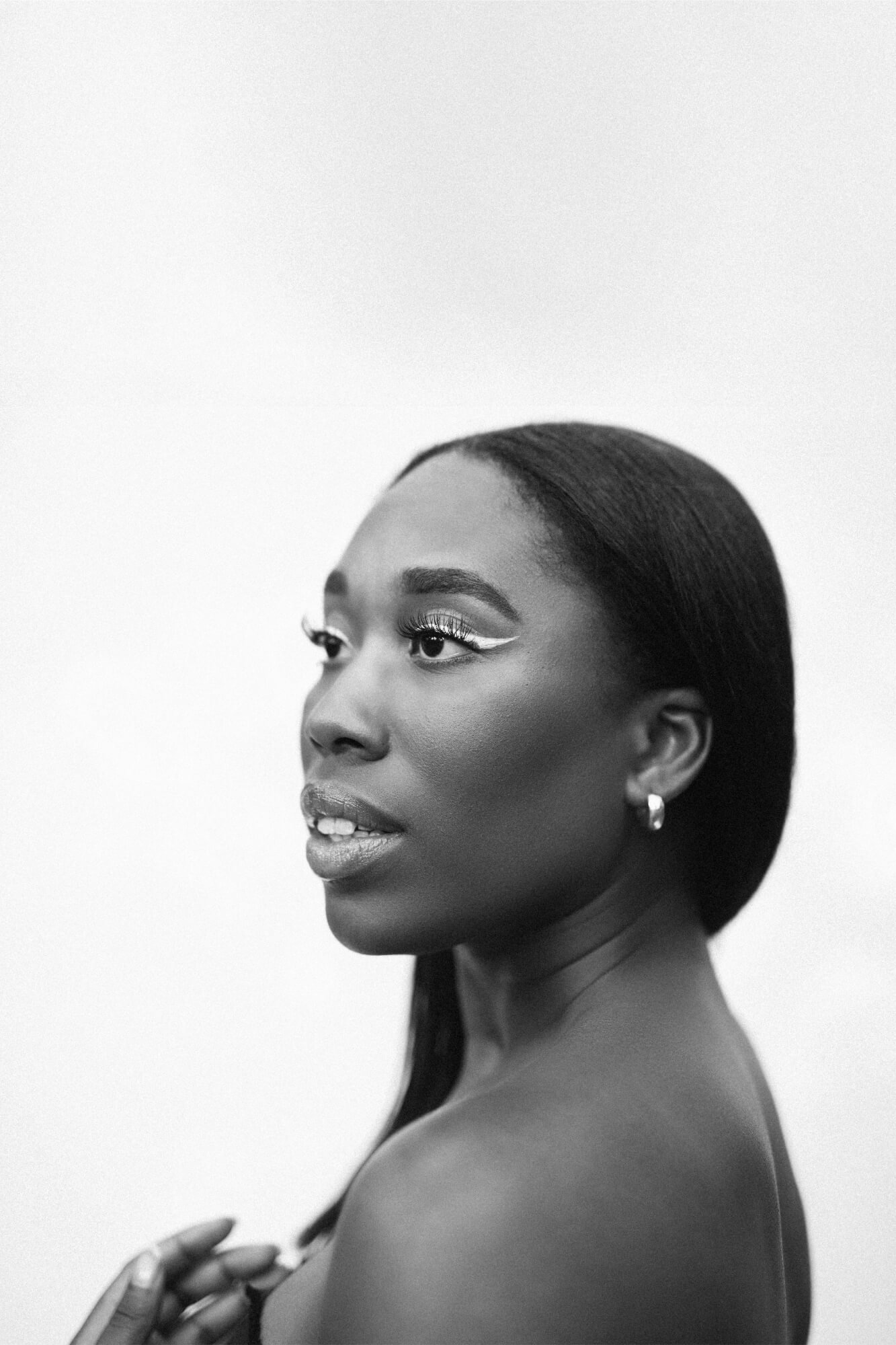 Black and white portrait of woman with bold eyeliner