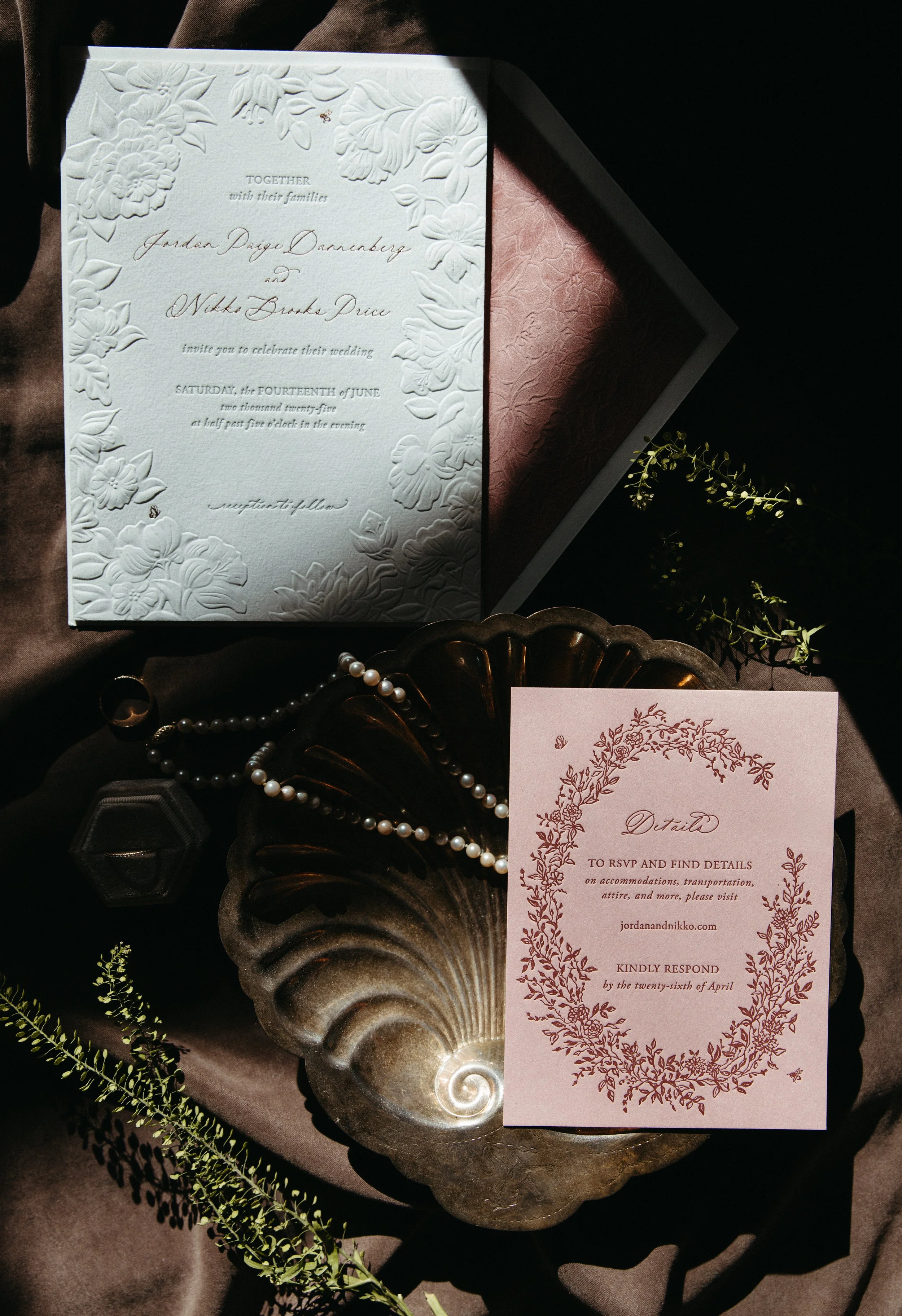 Wedding invitation suite styled with flowers.
