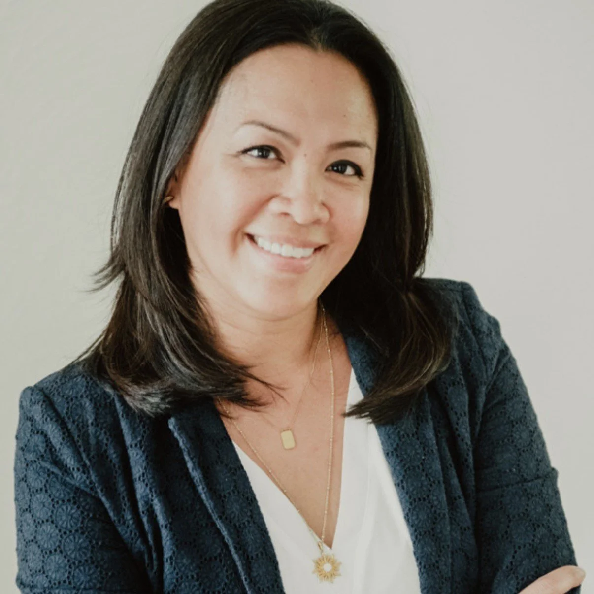 Portrait Dr. Regina Brian against a plain light background.