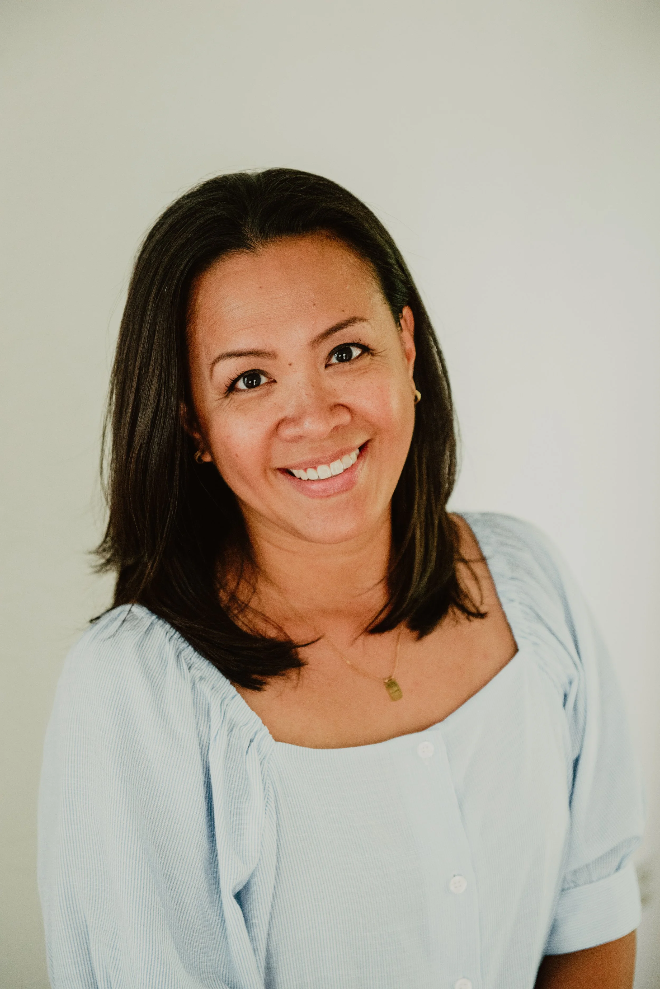 Portrait of Dr. Regina Brian against a plain light background.