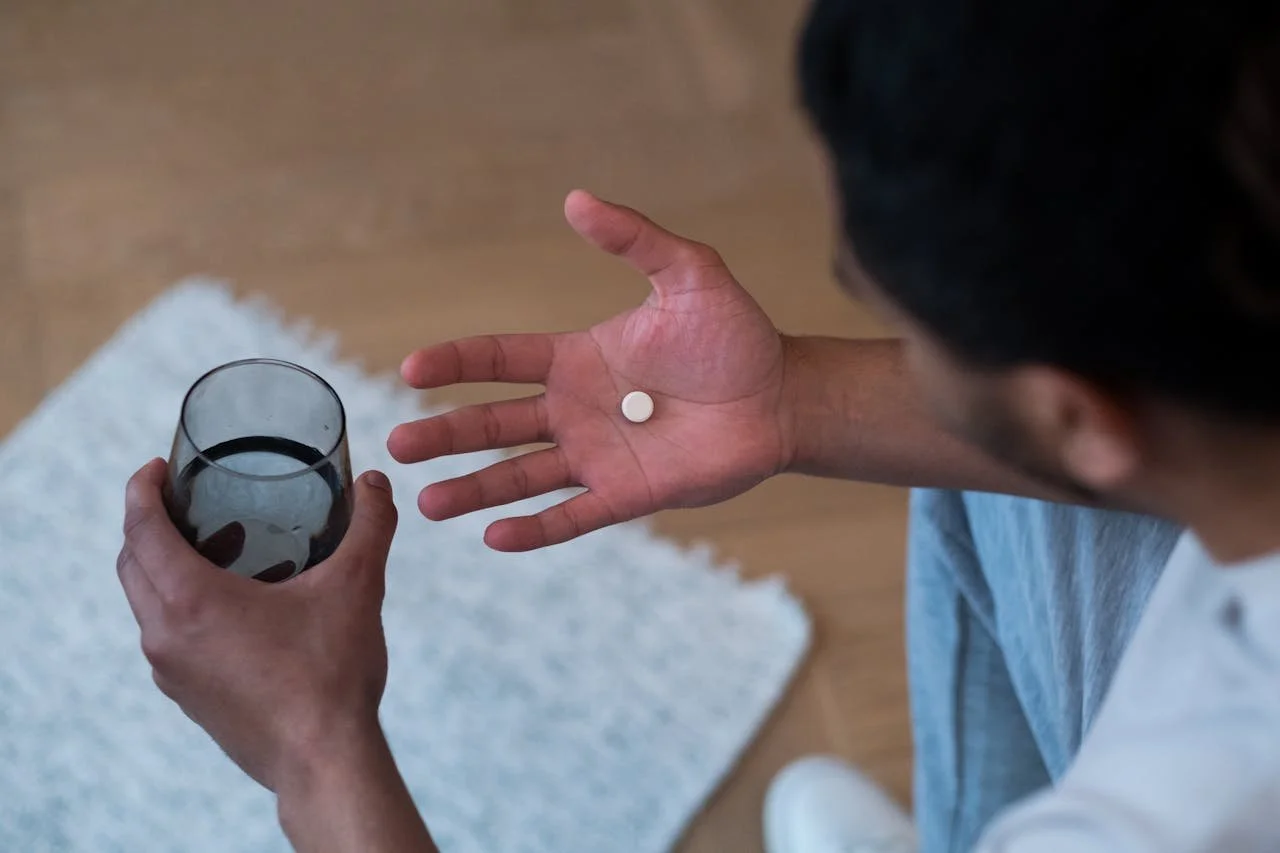 man-taking-a-pill