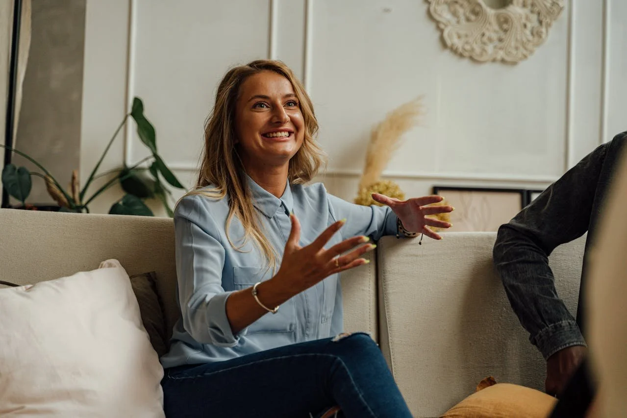 smiling-woman-sitting-on-a-couch