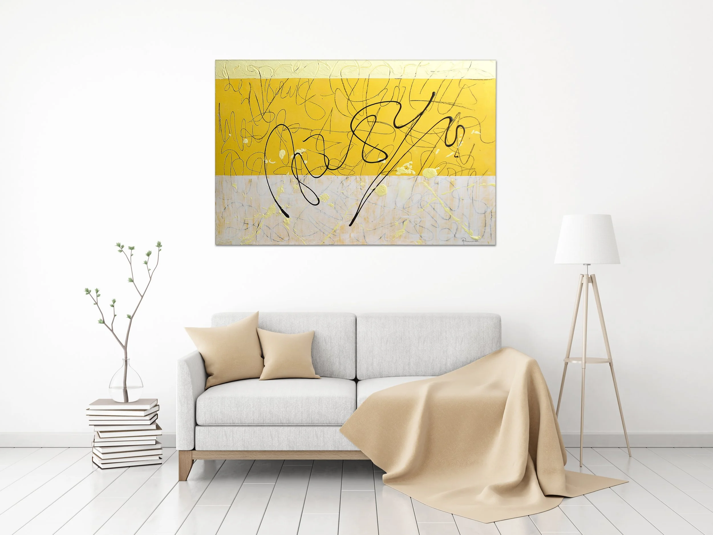 Minimalist living room with a white sofa, beige pillows, beige throw blanket, a tall floor lamp, a unique side table with stacked books, a bare branch in a clear glass vase, and an abstract yellow and white painting on the wall.