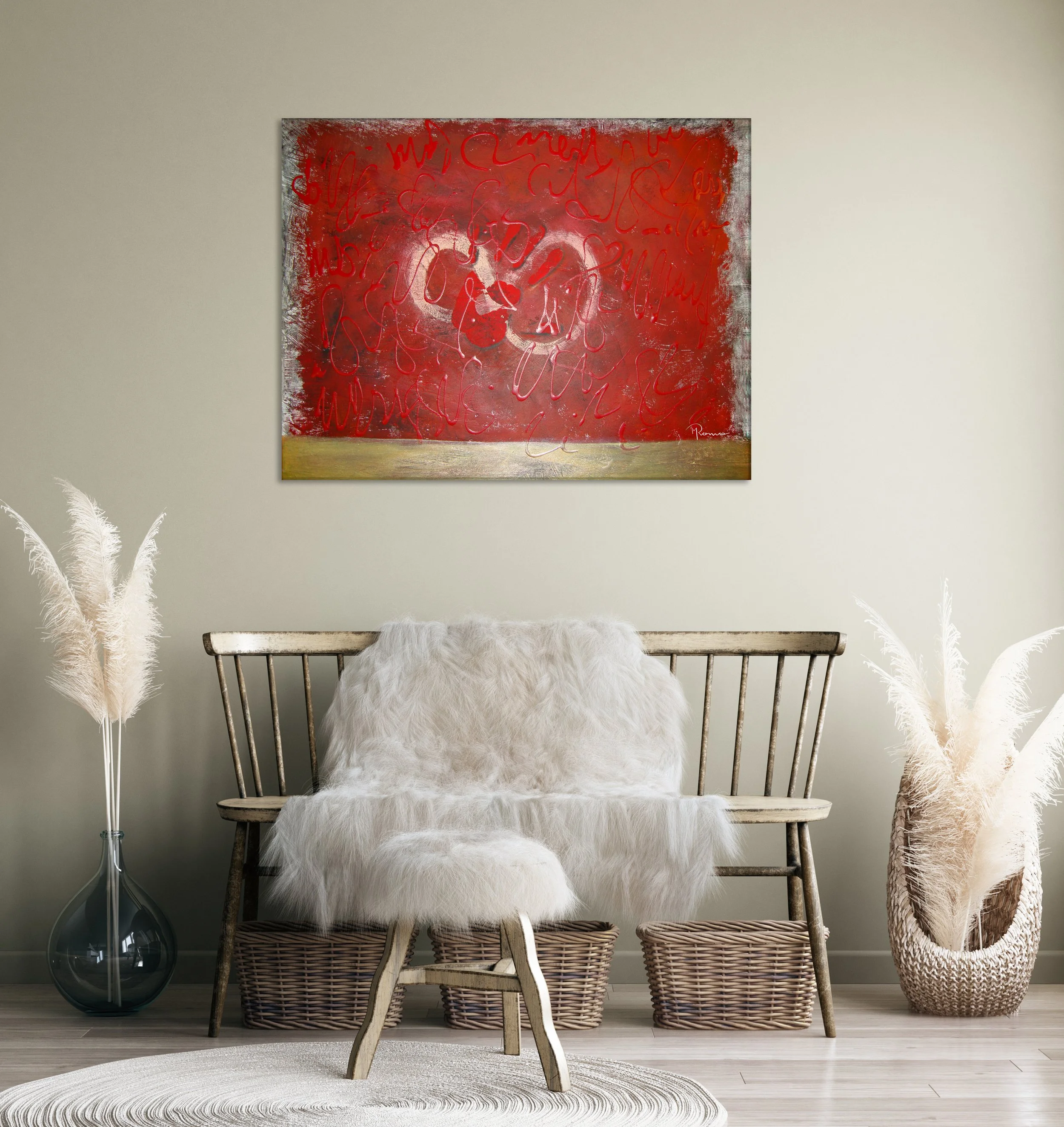 Living room with a wooden bench draped with white faux fur, a small matching stool, large pampas grass in vases on either side, a wicker basket, and an abstract red and white painting on the wall.