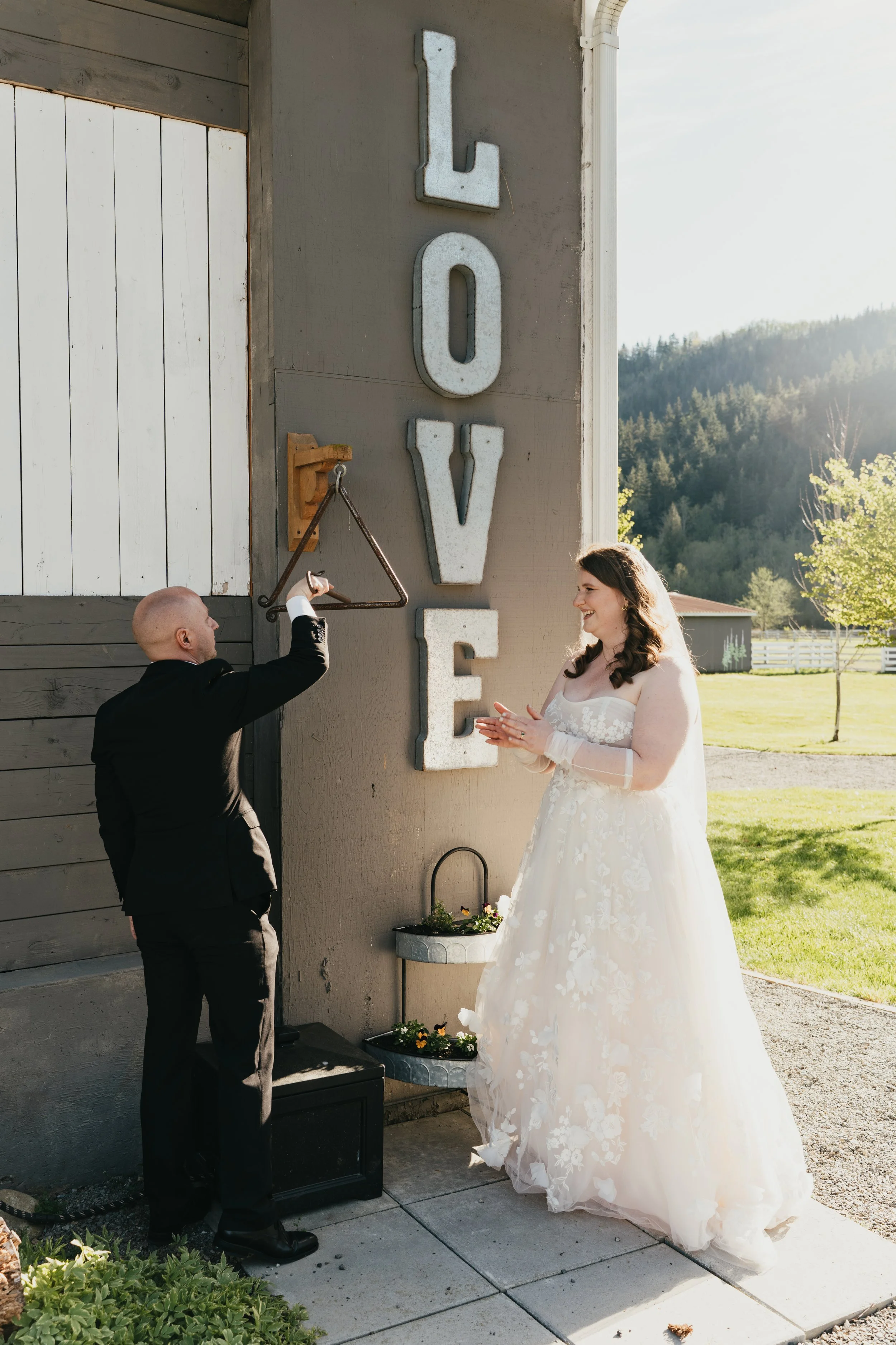 two brides with lanterns in their hands walk towards the camera on their elopement day
